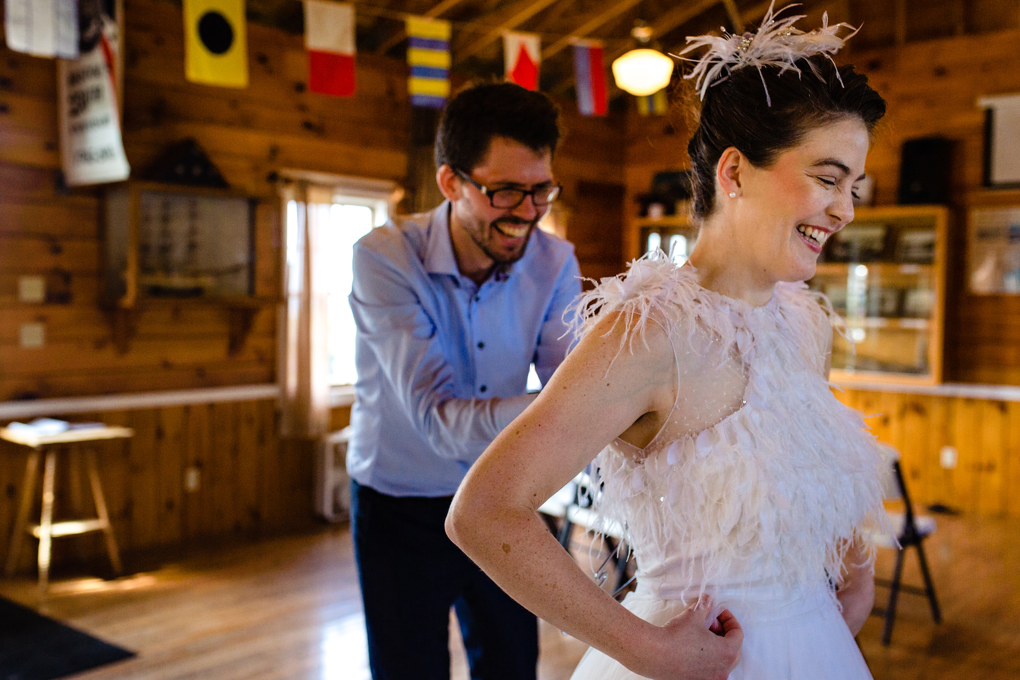 A bride and groom get ready at Pemaquid Point Lighthouse in Maine