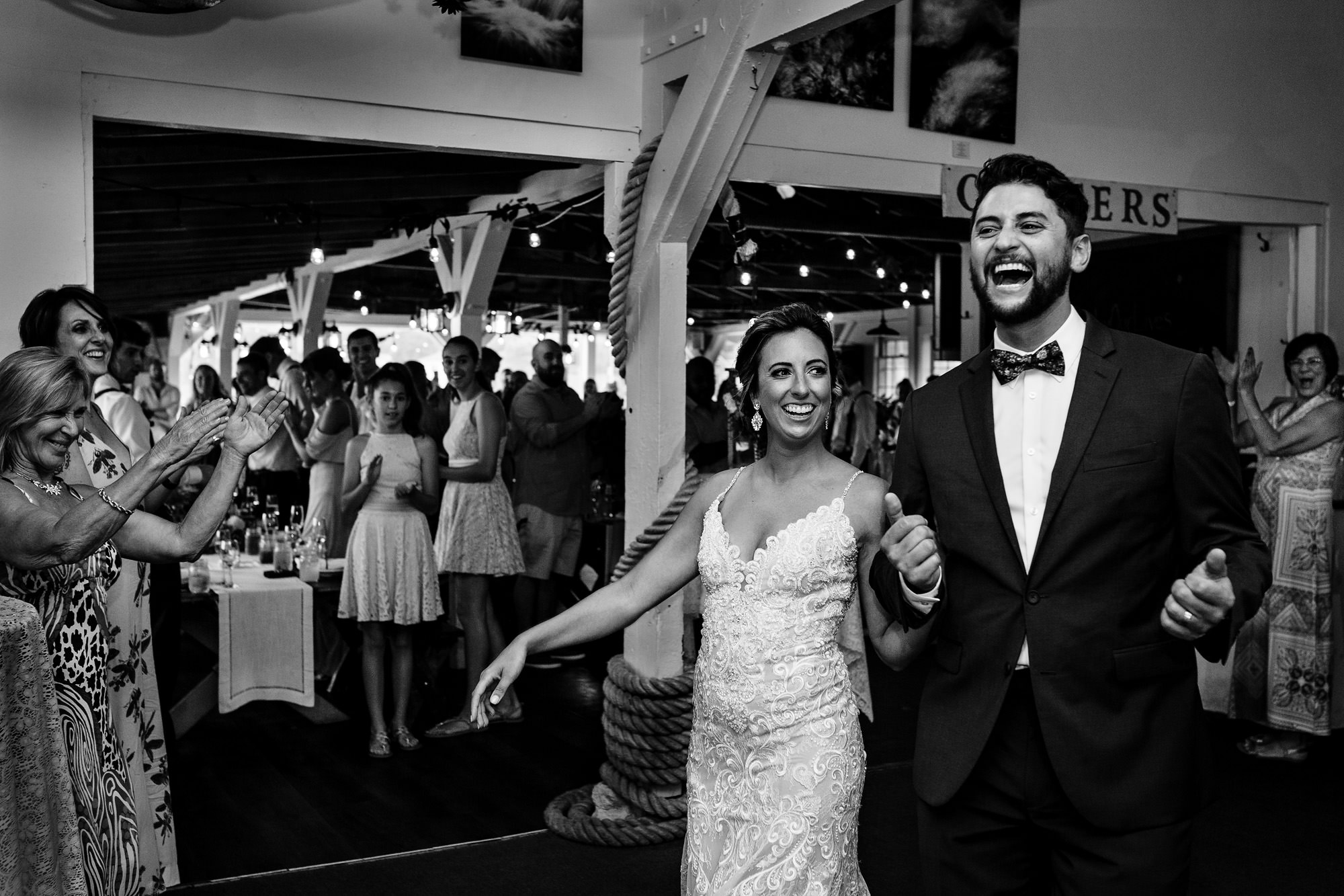 The bride and groom make their entrance at their Contented Sole wedding in Maine
