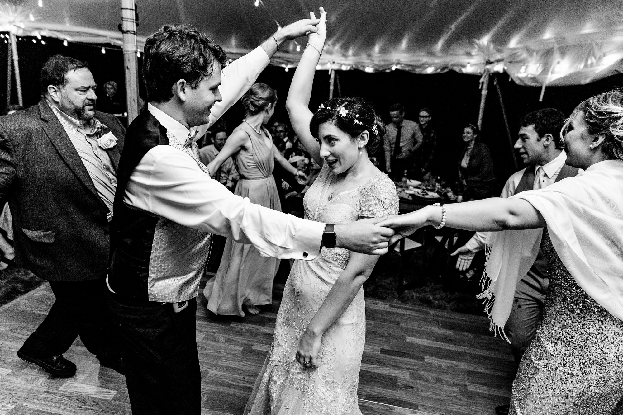 A fun and energetic dance floor at a Bradley Inn tented wedding in New Harbor, Maine