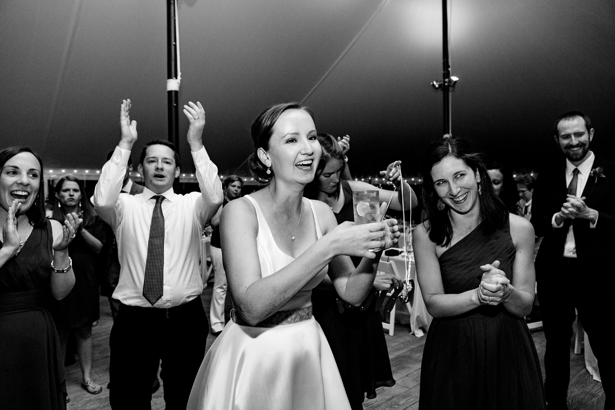 Documentary wedding photos of an energetic dance floor in Maine