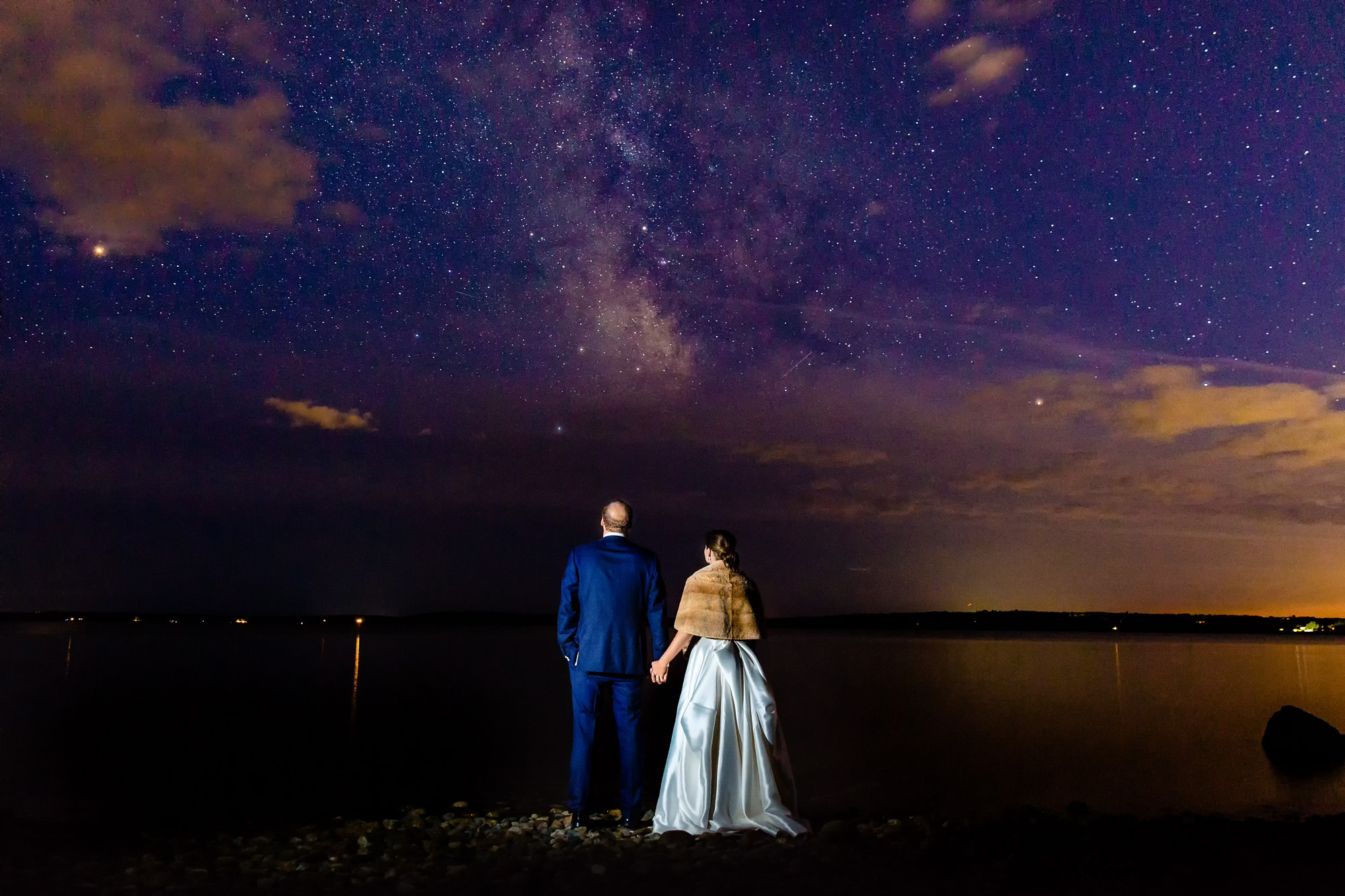 A starry night portrait of a bride and groom at their wedding at French's Point in Maine