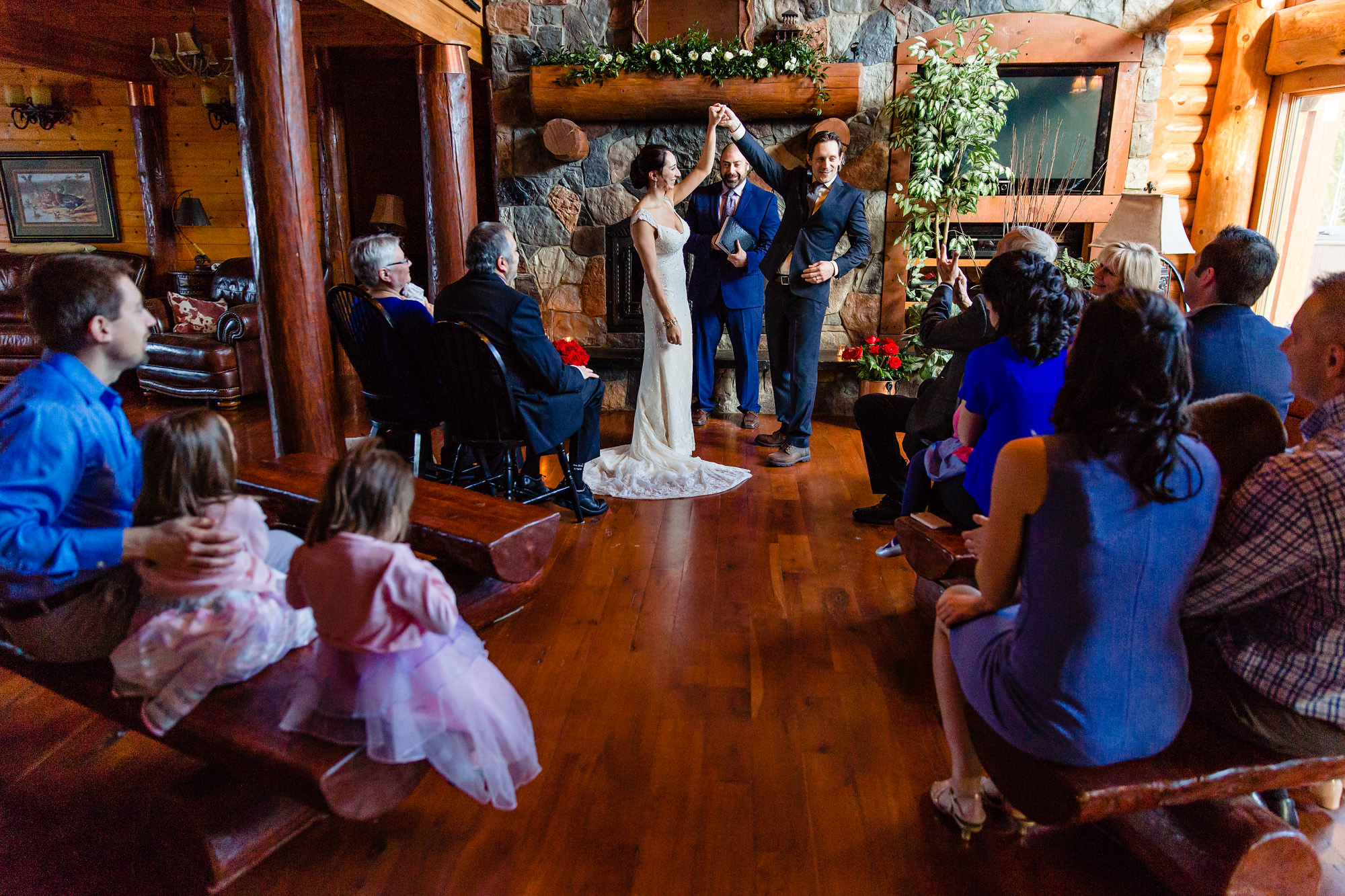 A bride and groom celebrate being husband and wife at their Moose Lake Ranch ceremony in Maine