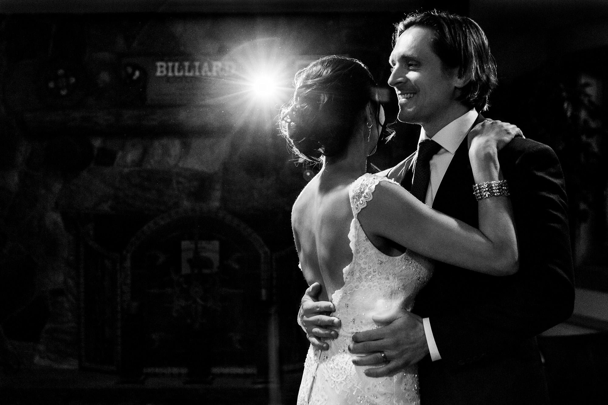 A bride and groom dance at their small winter wedding reception in Maine