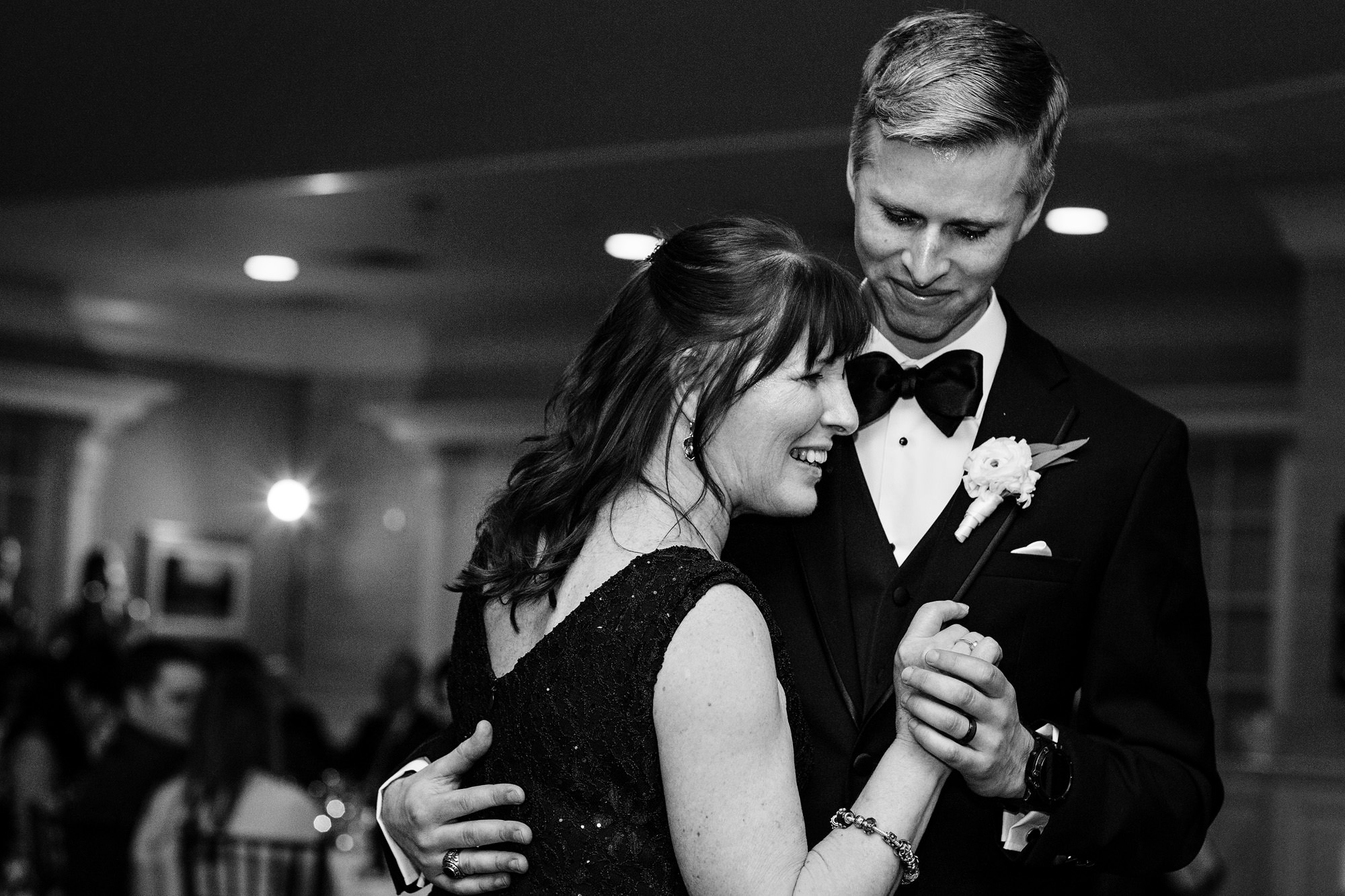 The groom dances with his mother at his Point Lookout wedding