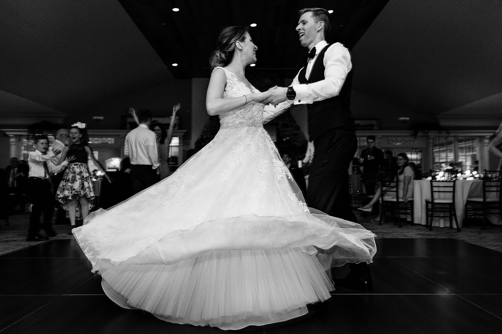 The bride and groom dance on their dance floor at their Maine wedding
