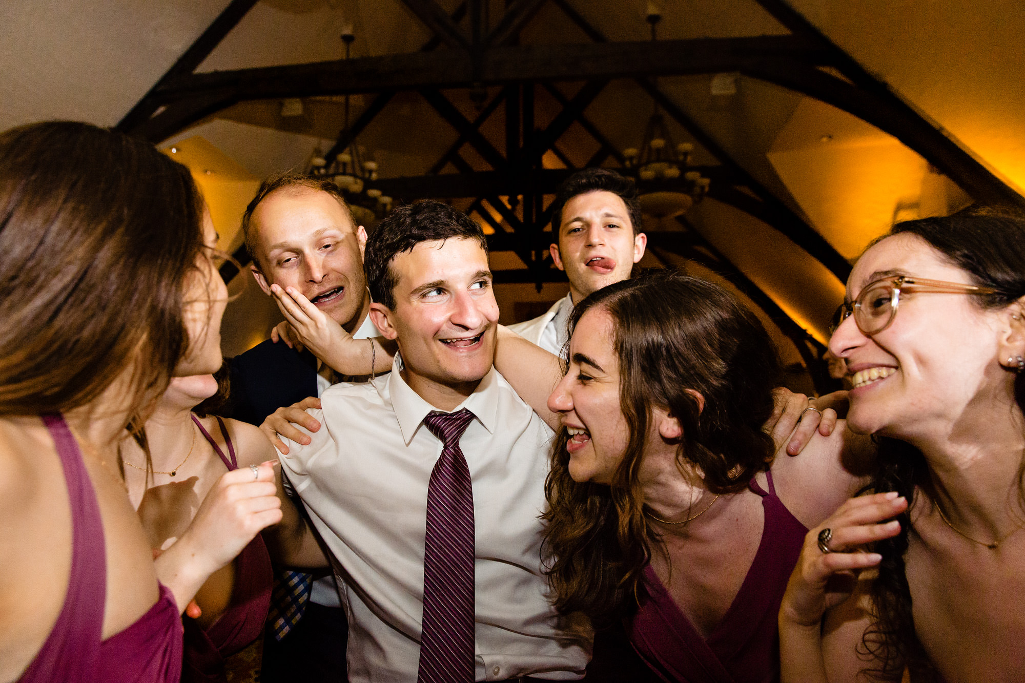 People dance energetically at a Bar Harbor Club Maine wedding