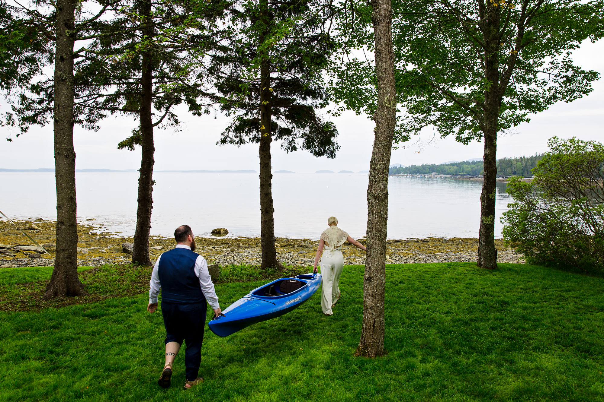 The bride and groom kayak at their Hancock Maine downeast wedding