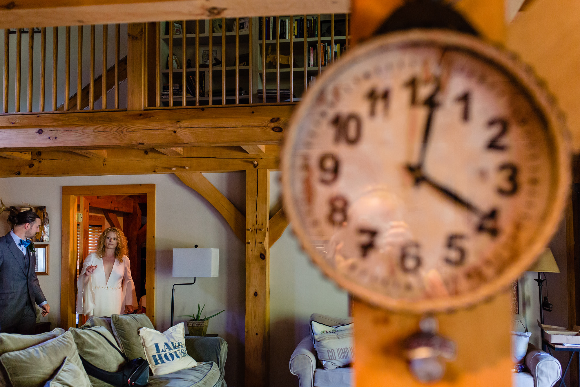 A bride and groom watches the clock for their 4:00 ceremony in Maine
