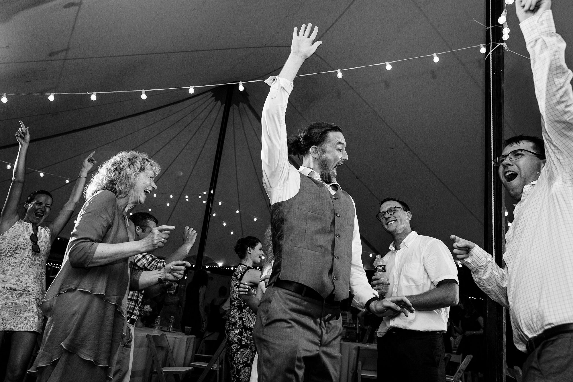 Guests dance at a tented wedding in western Maine