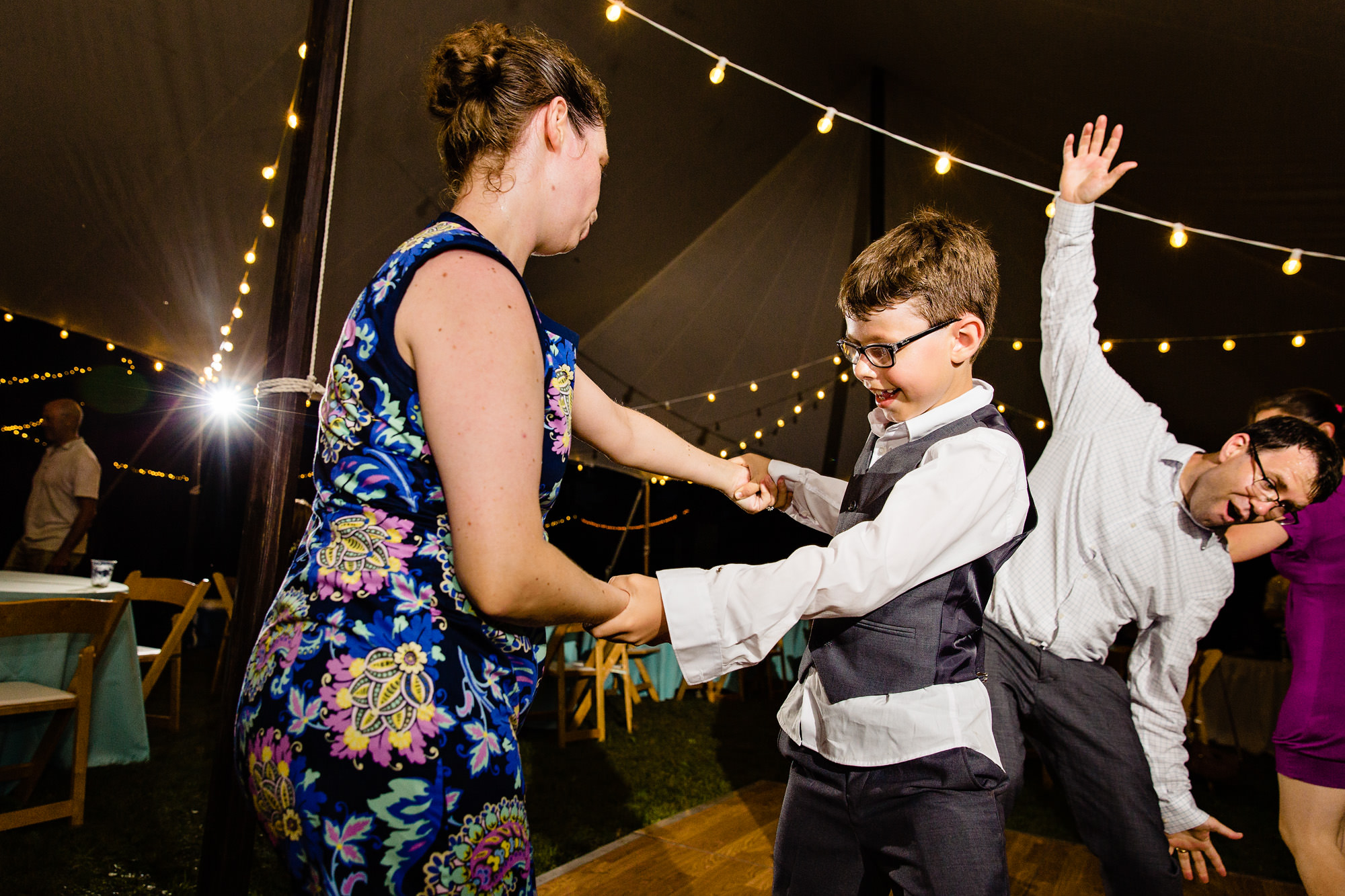 Guests dance at a tented wedding in western Maine