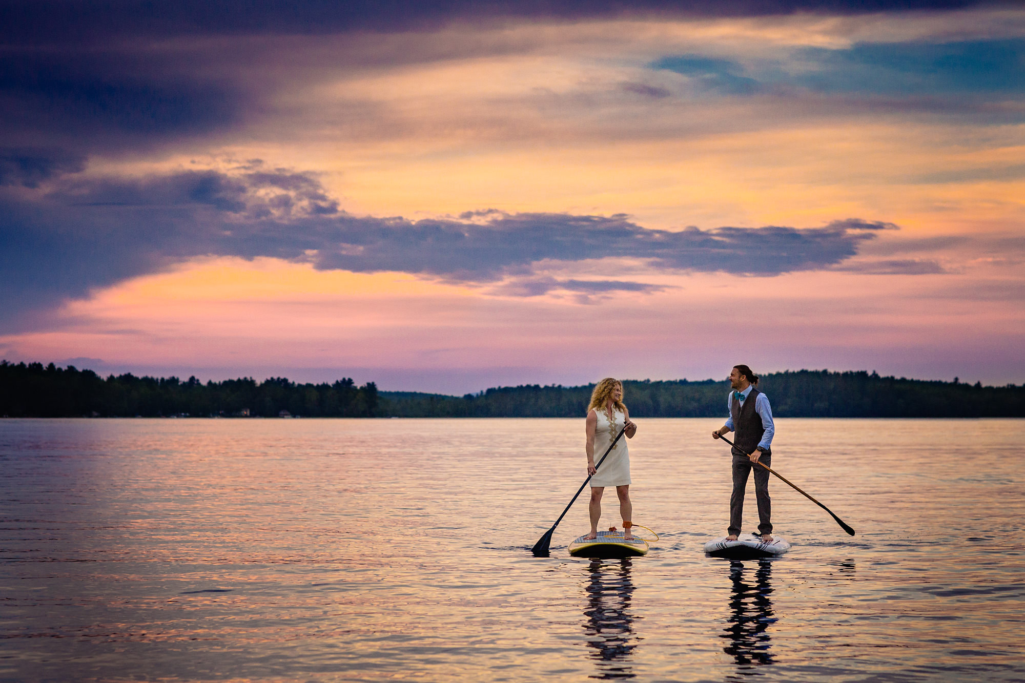 A bride and groom paddleboarded at their Maine lakeside wedding 