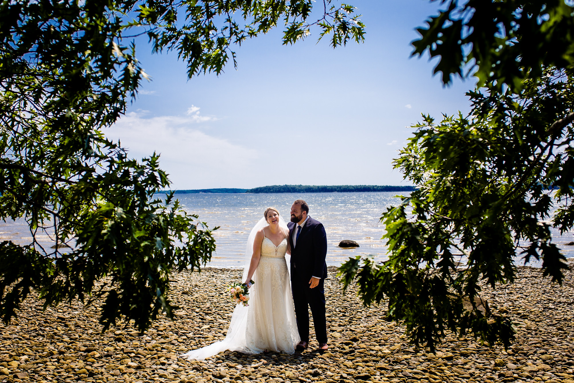 A wedding portrait taken on the beach at French's Point in Maine