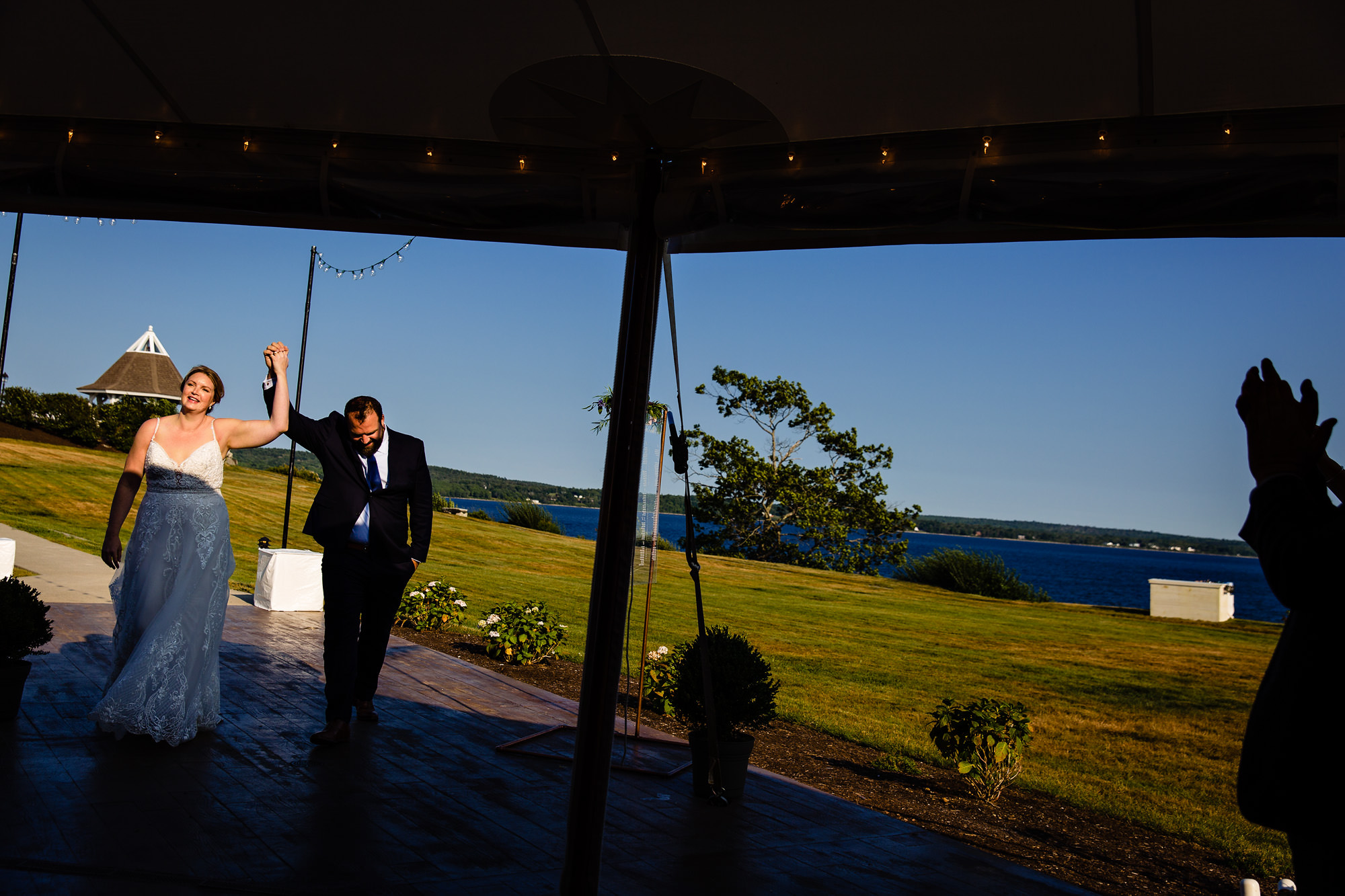 The bride and groom are introduced at their wedding at French's Point in Maine