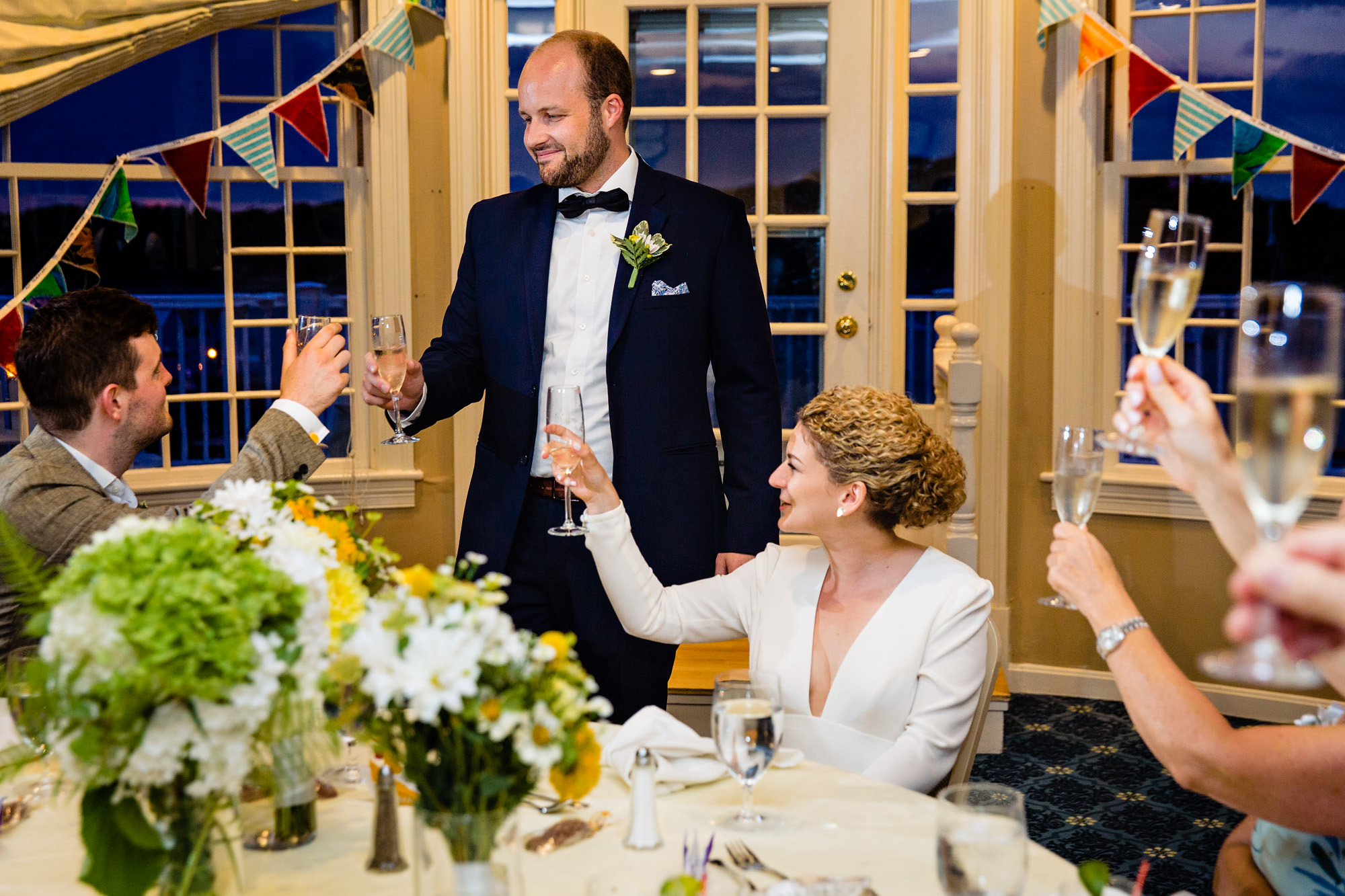 The best man toasts the bride and groom at their Bar Harbor Inn Wedding