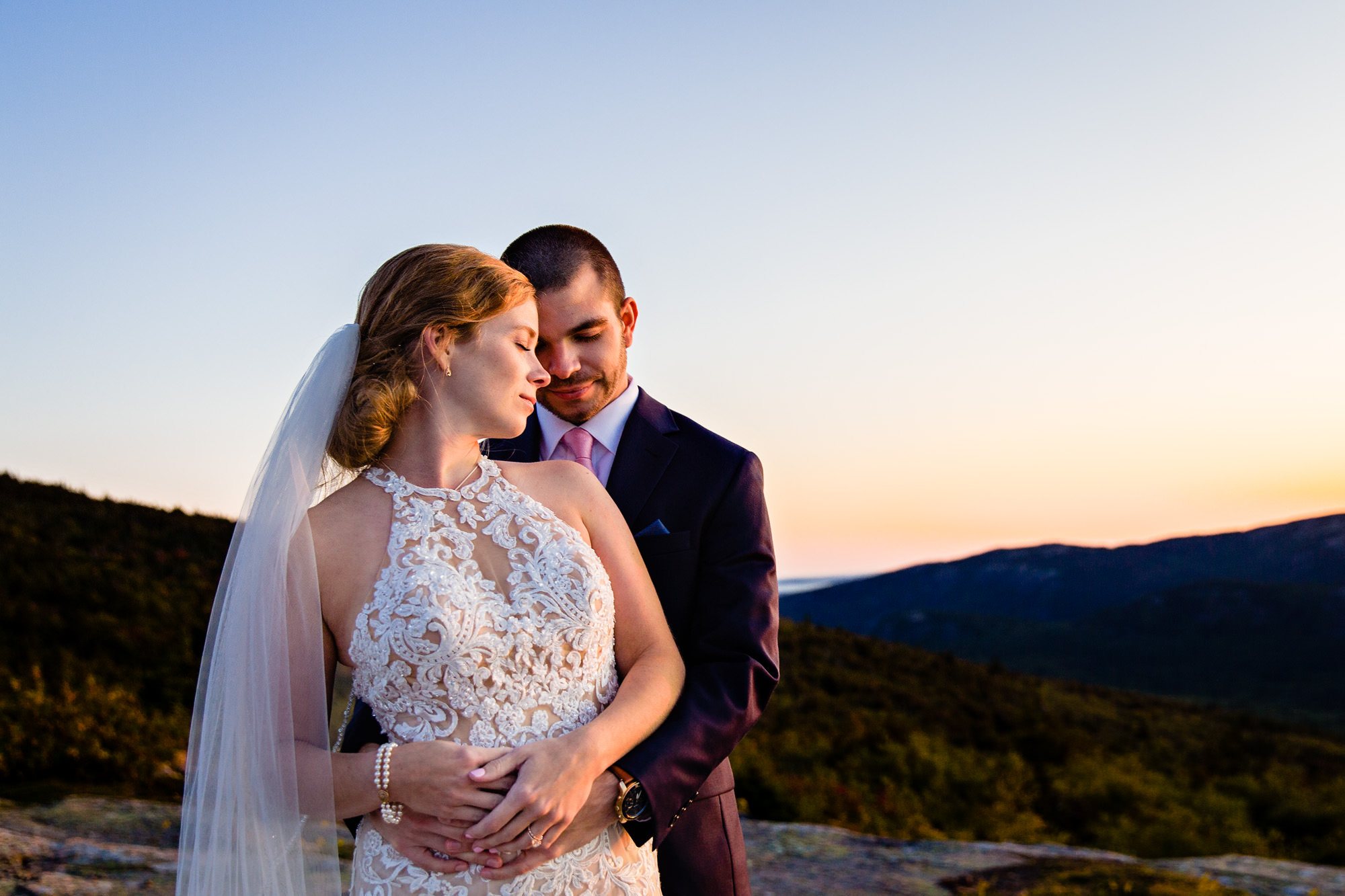 Beautiful sunset portraits taken at an elopement on Cadillac Mountain