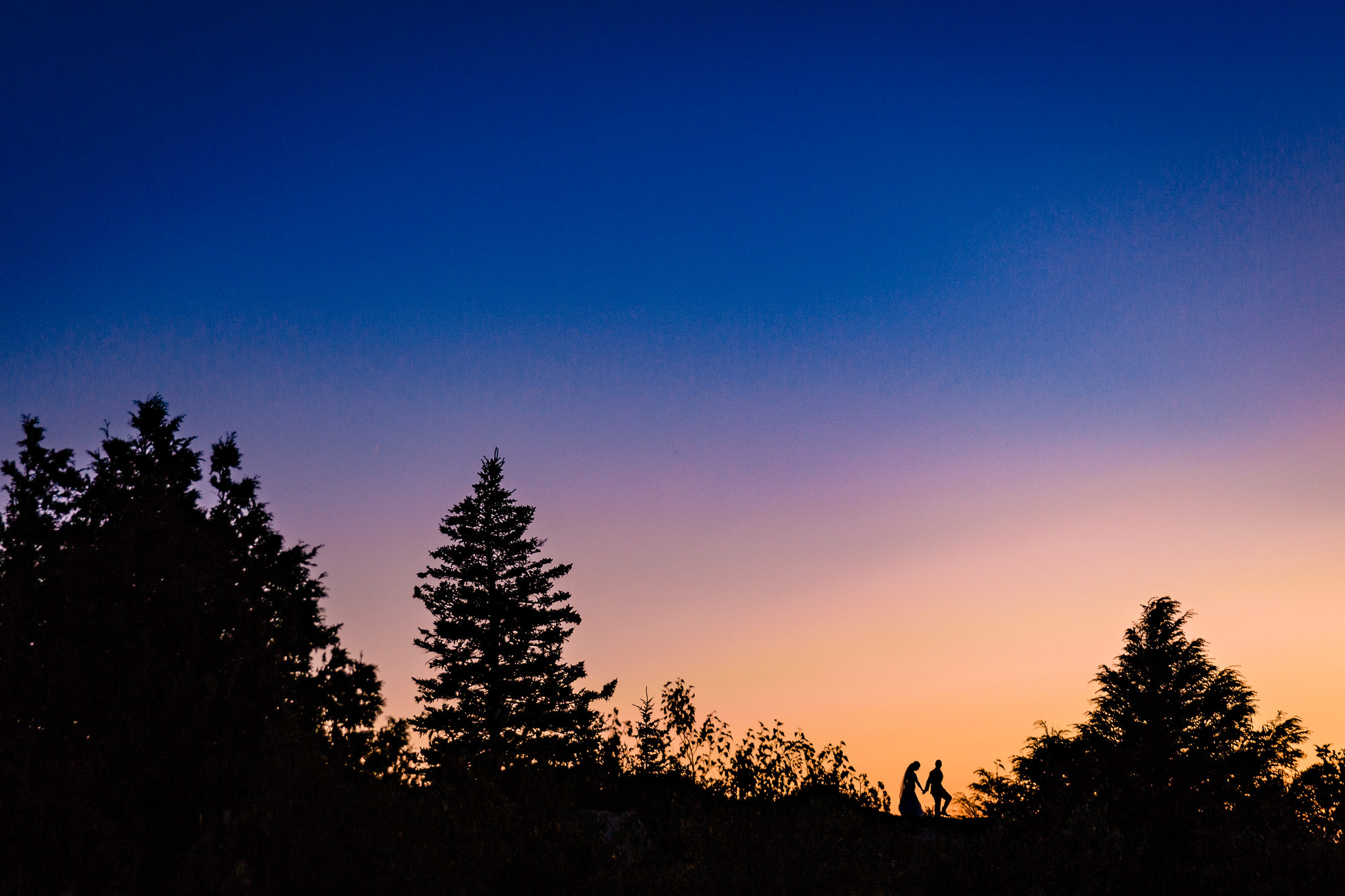 Beautiful sunset portraits taken at an elopement on Cadillac Mountain