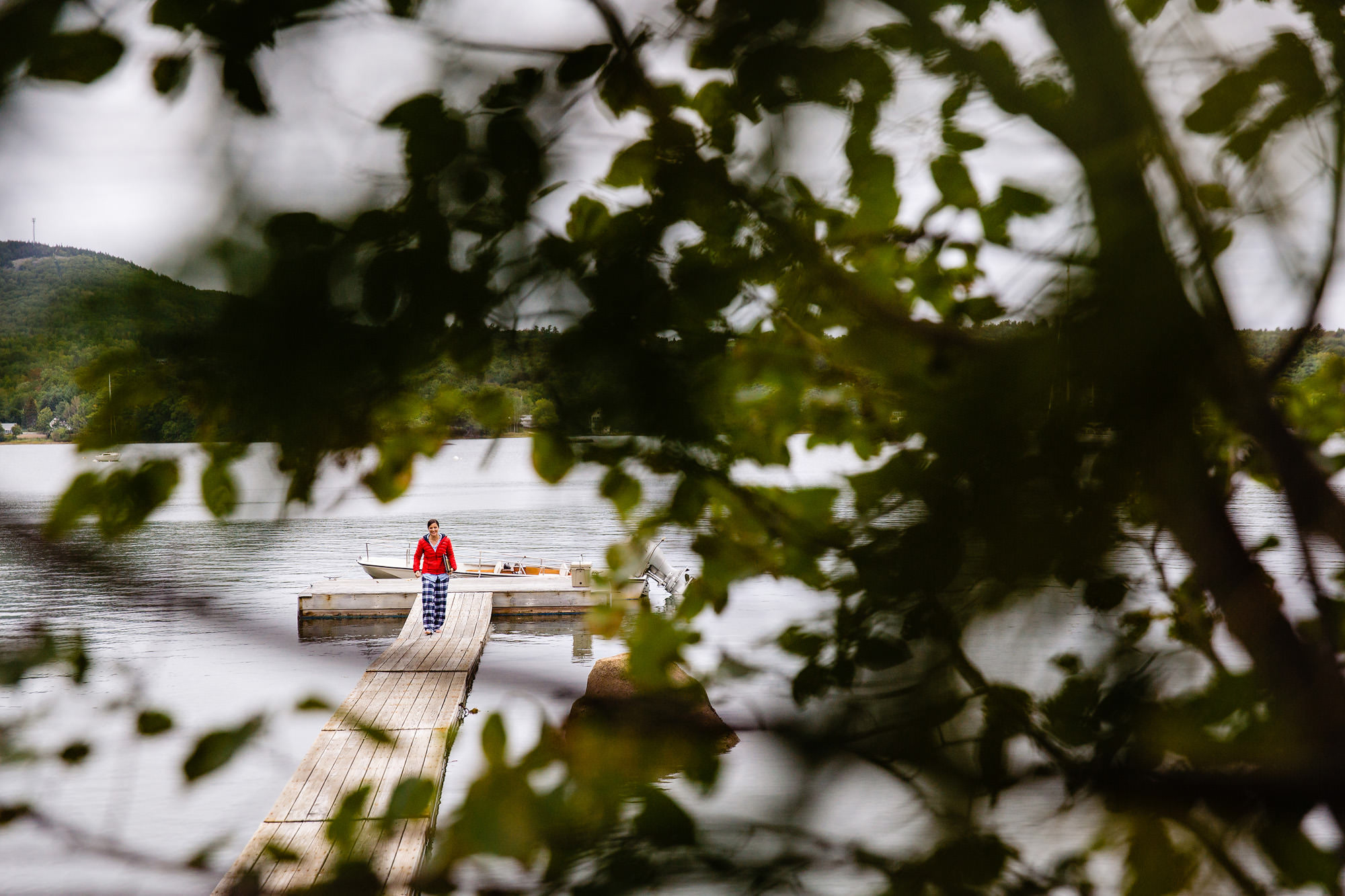 A bride writes her vows on a dock in preparation for her Blue Hill Maine wedding