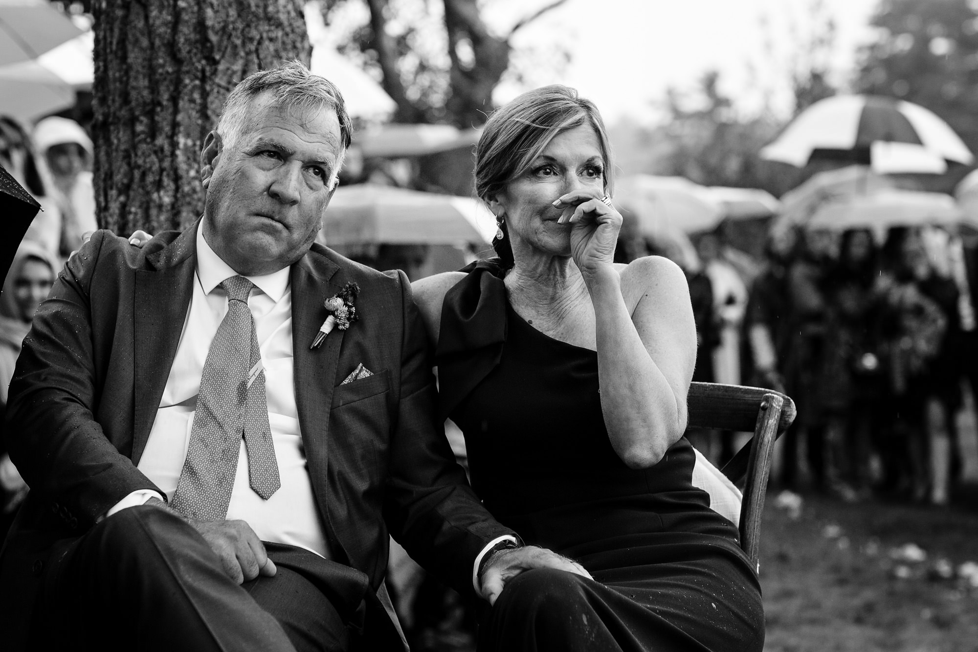 The mother of the groom cries during the vows at a Blue Hill Country Club wedding