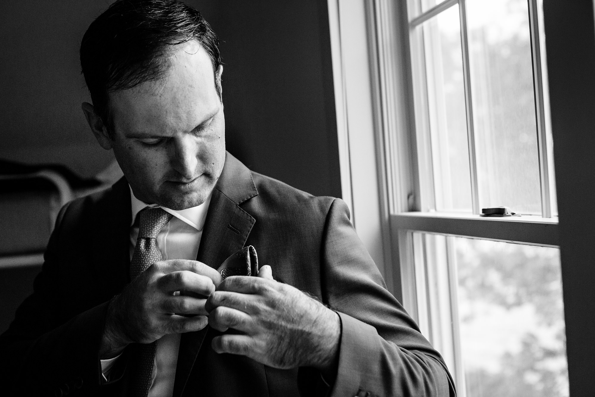 A groom prepares for a Maine wedding