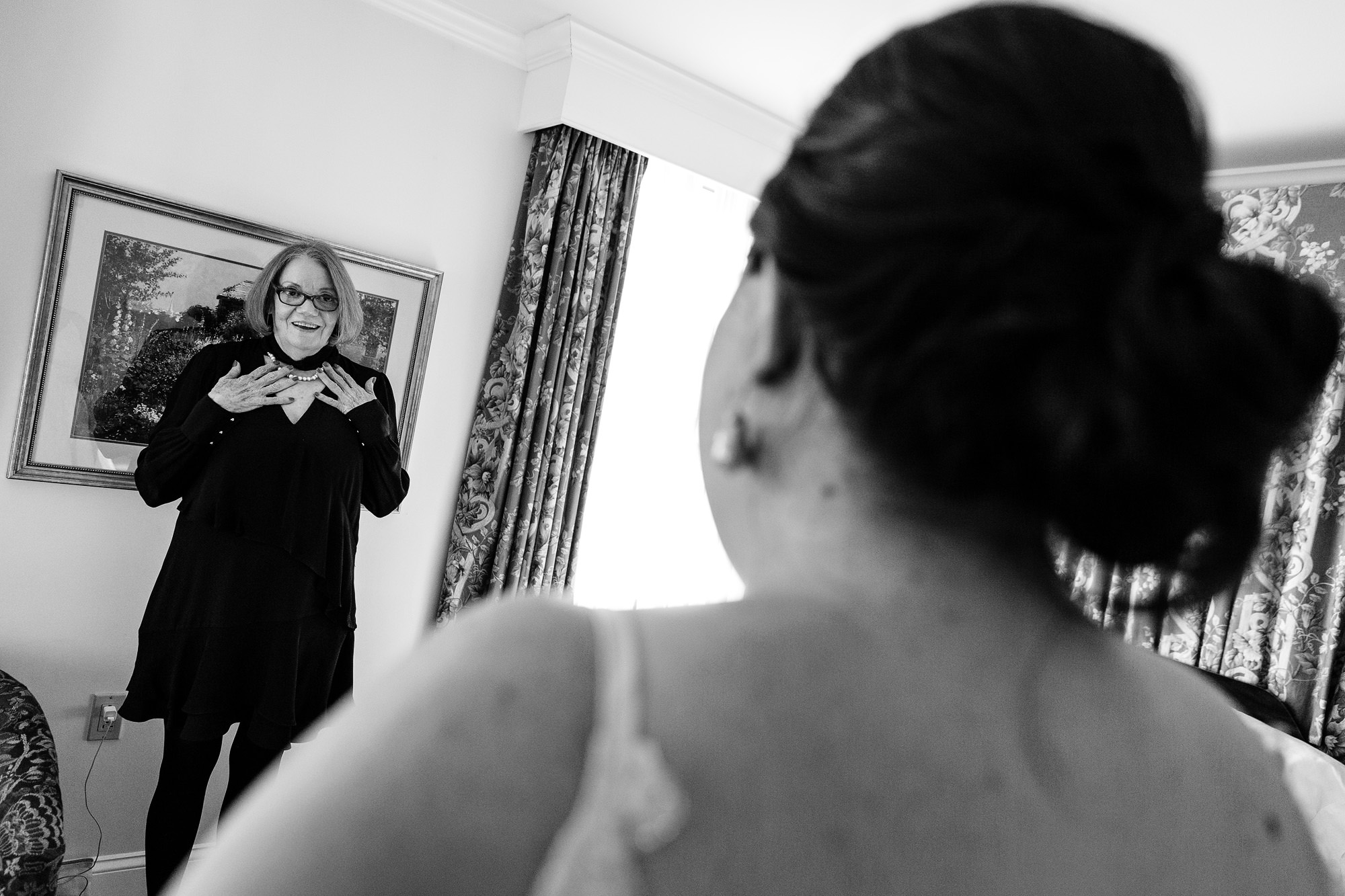 A family friend reacts to the bride at her wedding in Freeport, Maine