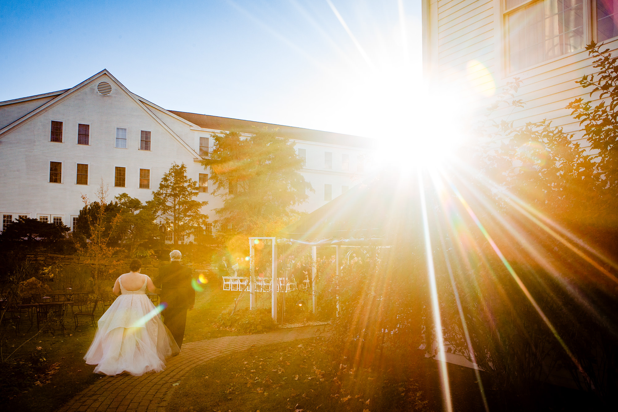 The bride and her father walk into her Harraseeket Inn wedding in Freeport Maine