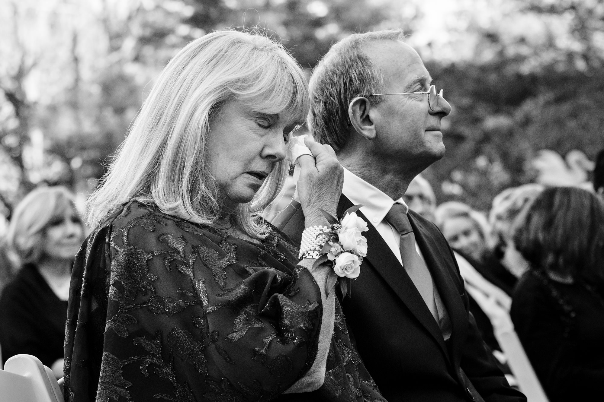 The mother of the groom cries during the southern Maine wedding ceremony