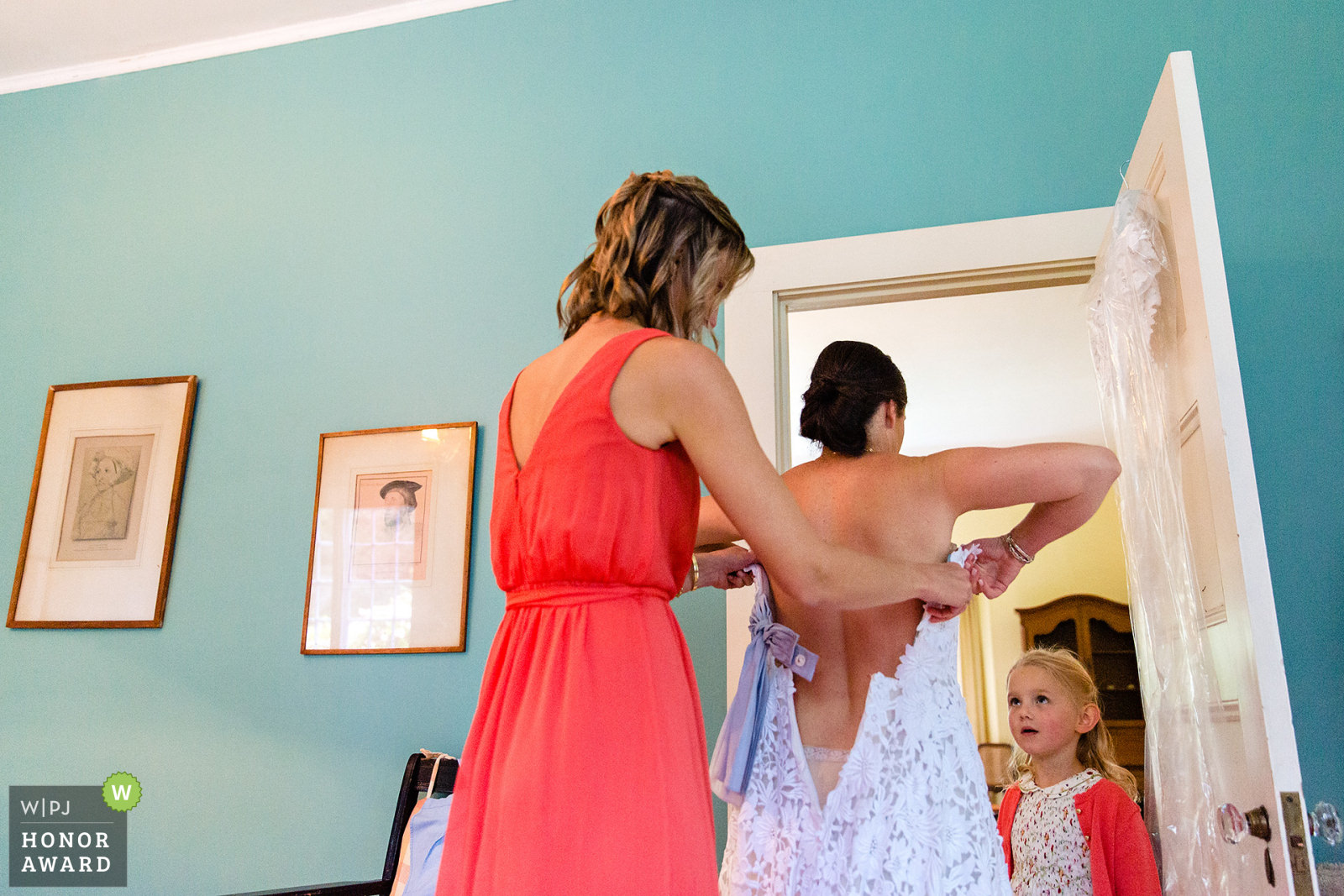 A bride gets dressed at her Blue Hill Maine wedding