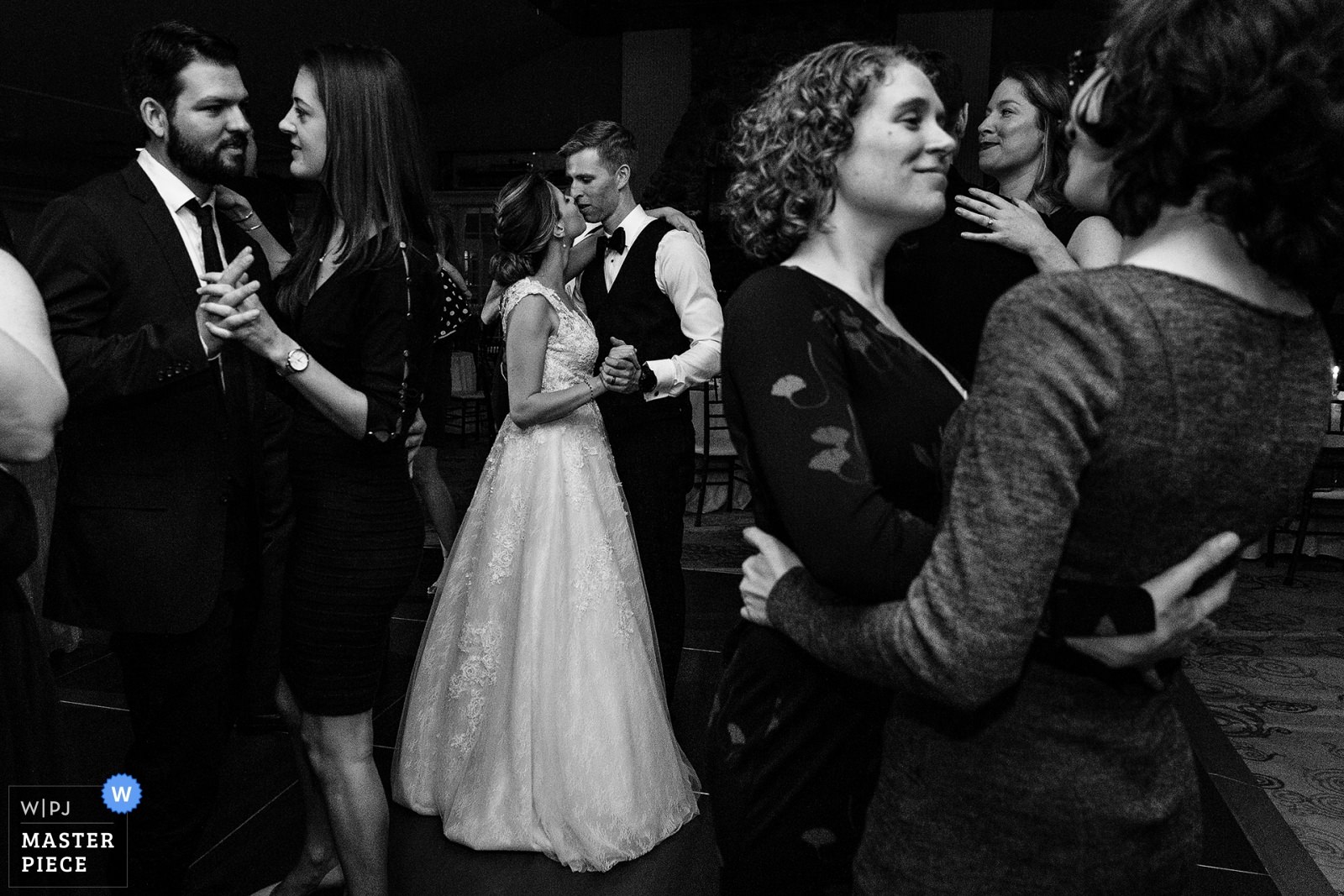 The bride and groom dance with their guests at a Camden Maine wedding