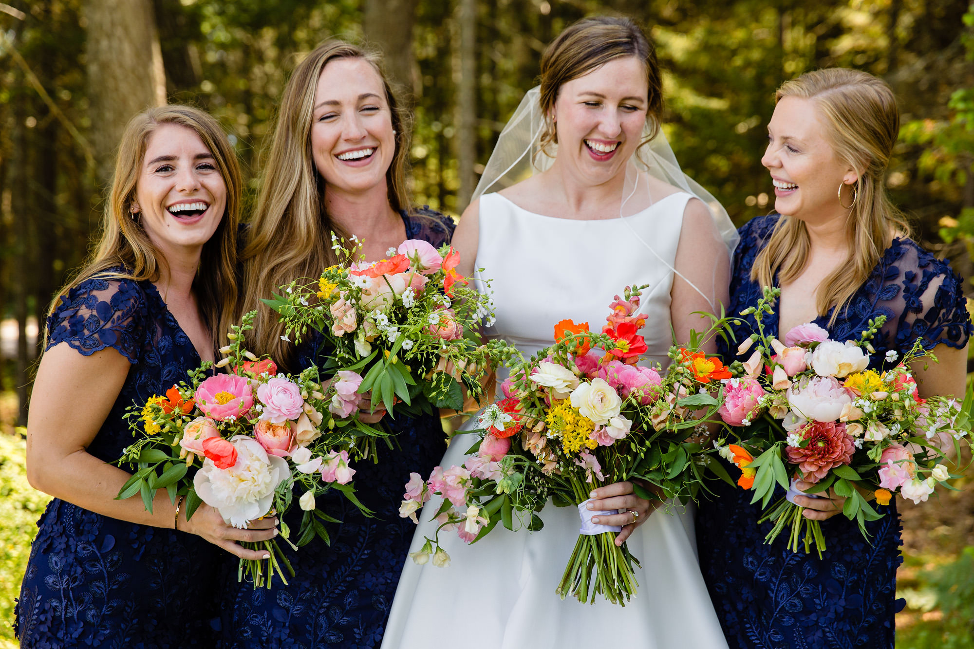 The bride with her bridesmaids at her wedding in Maine