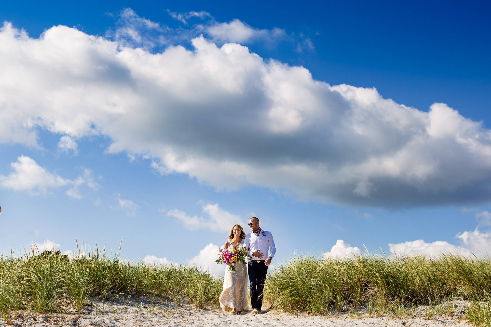 Candid ceremony photos from a Pine Point Beach wedding in Maine