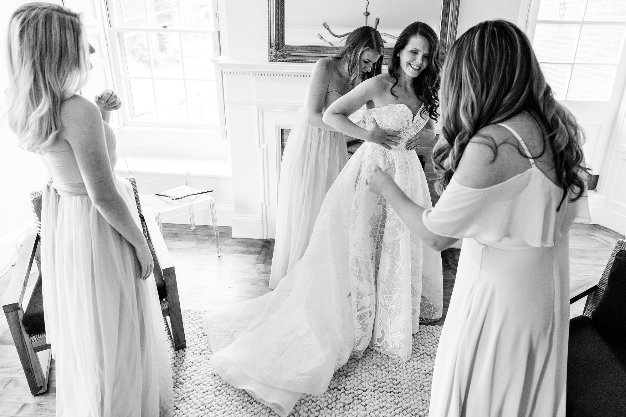The bride gets ready for her wedding with her bridesmaids at the Blind Tiger in Portland Maine