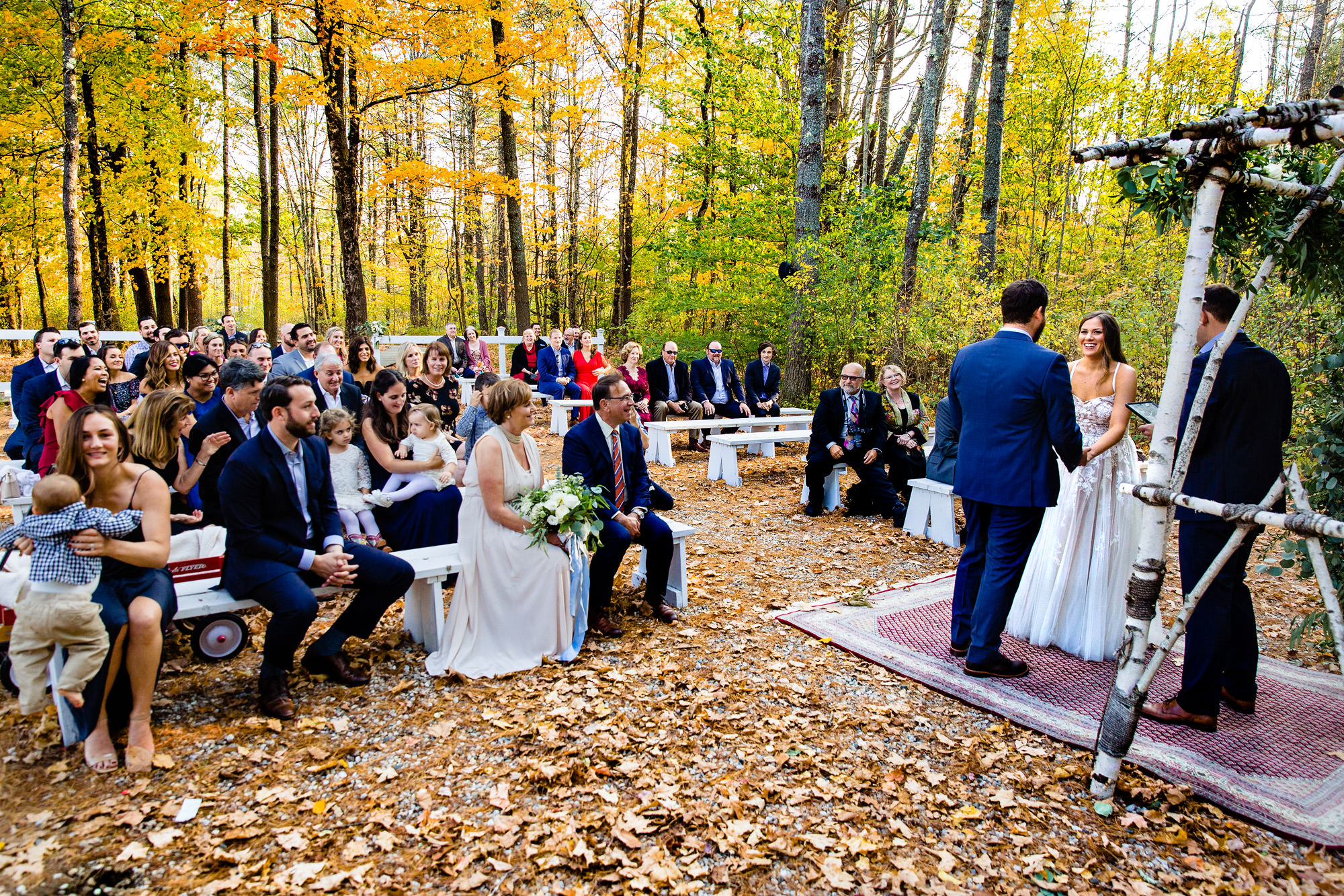 A fall wedding ceremony at Barn at Flanagan Farm in Buxton, Maine