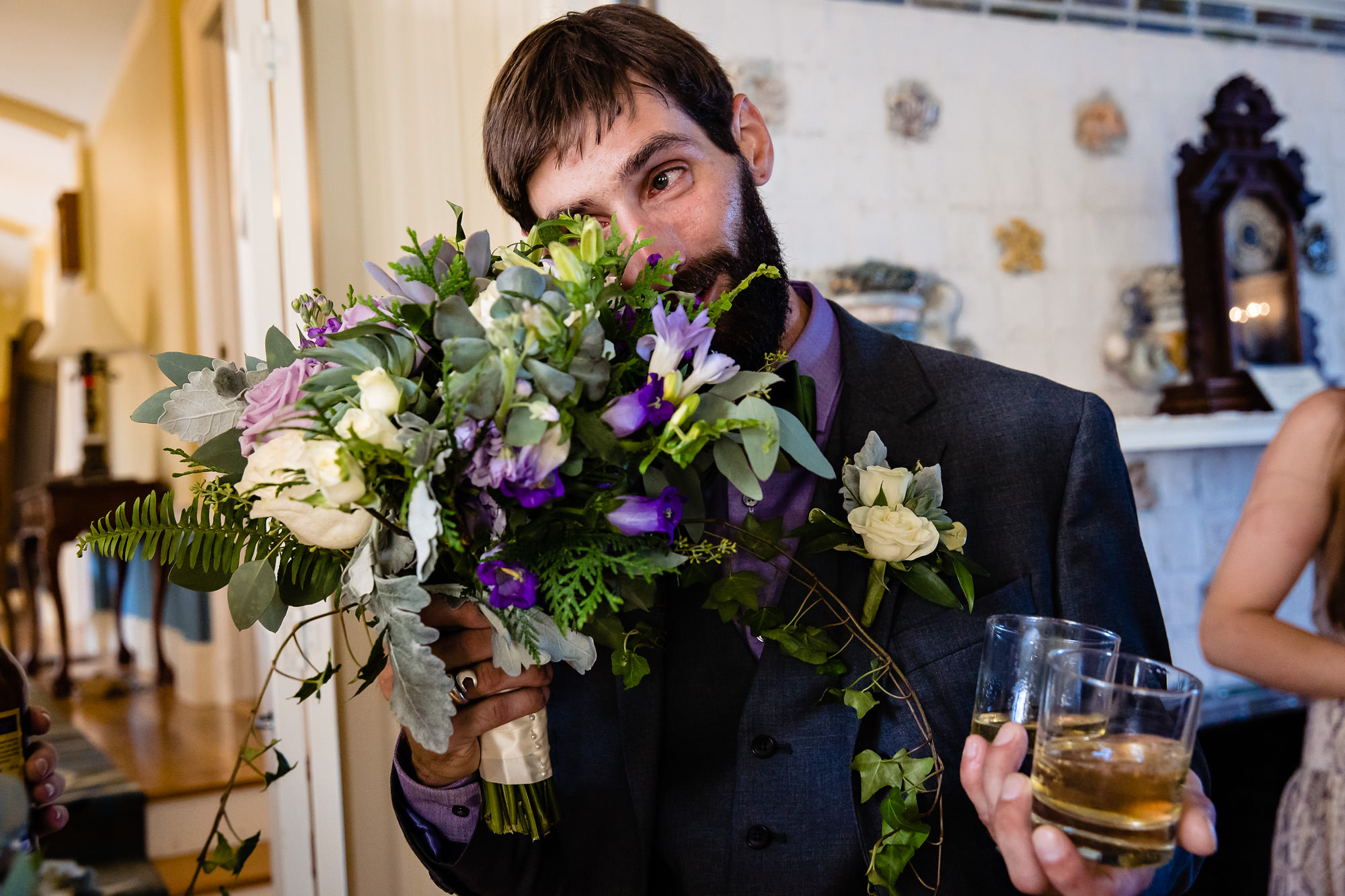 A groom gets emotional during cocktail hour.