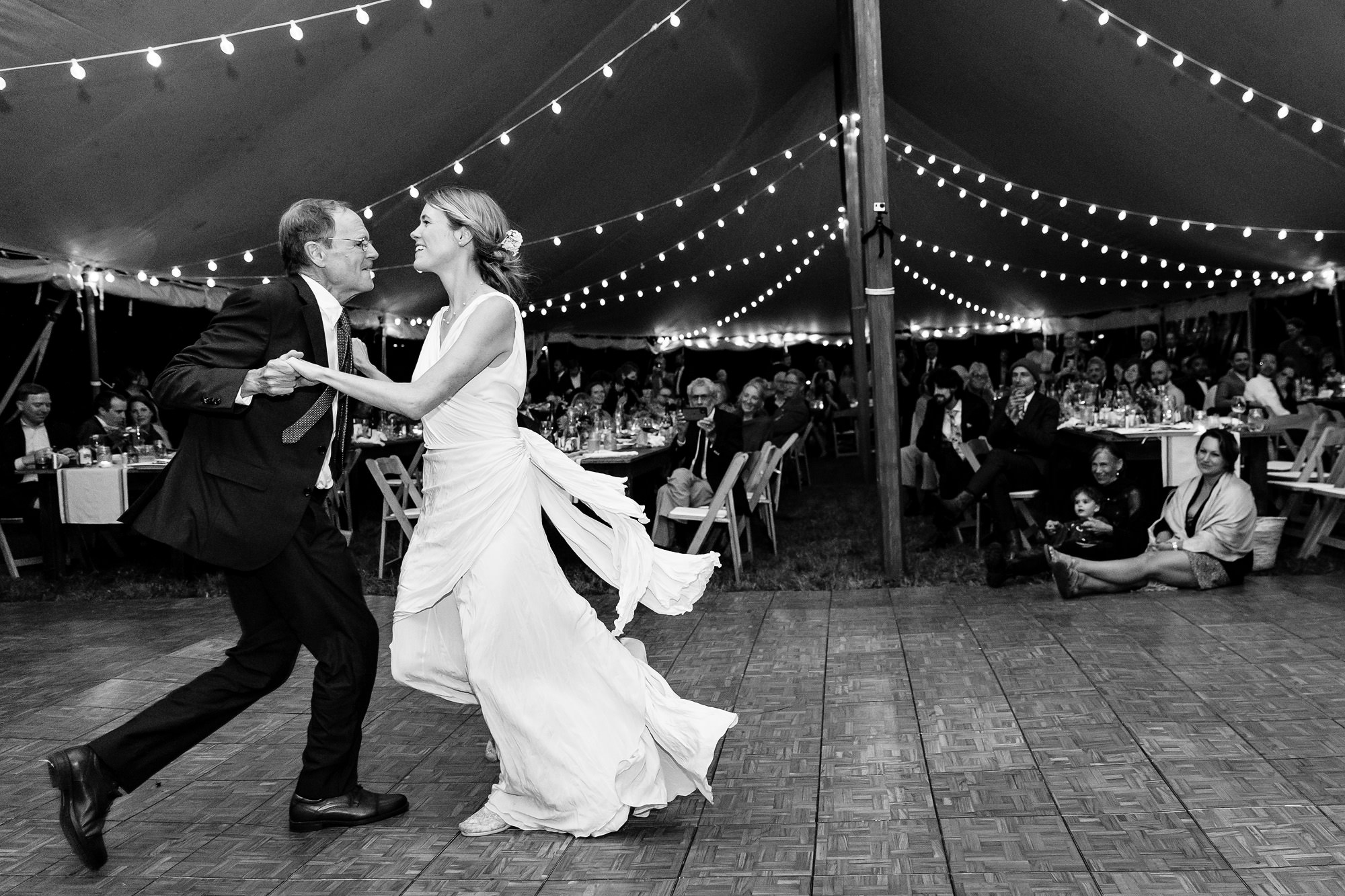 A tented wedding reception by the ocean in Blue Hill, Maine