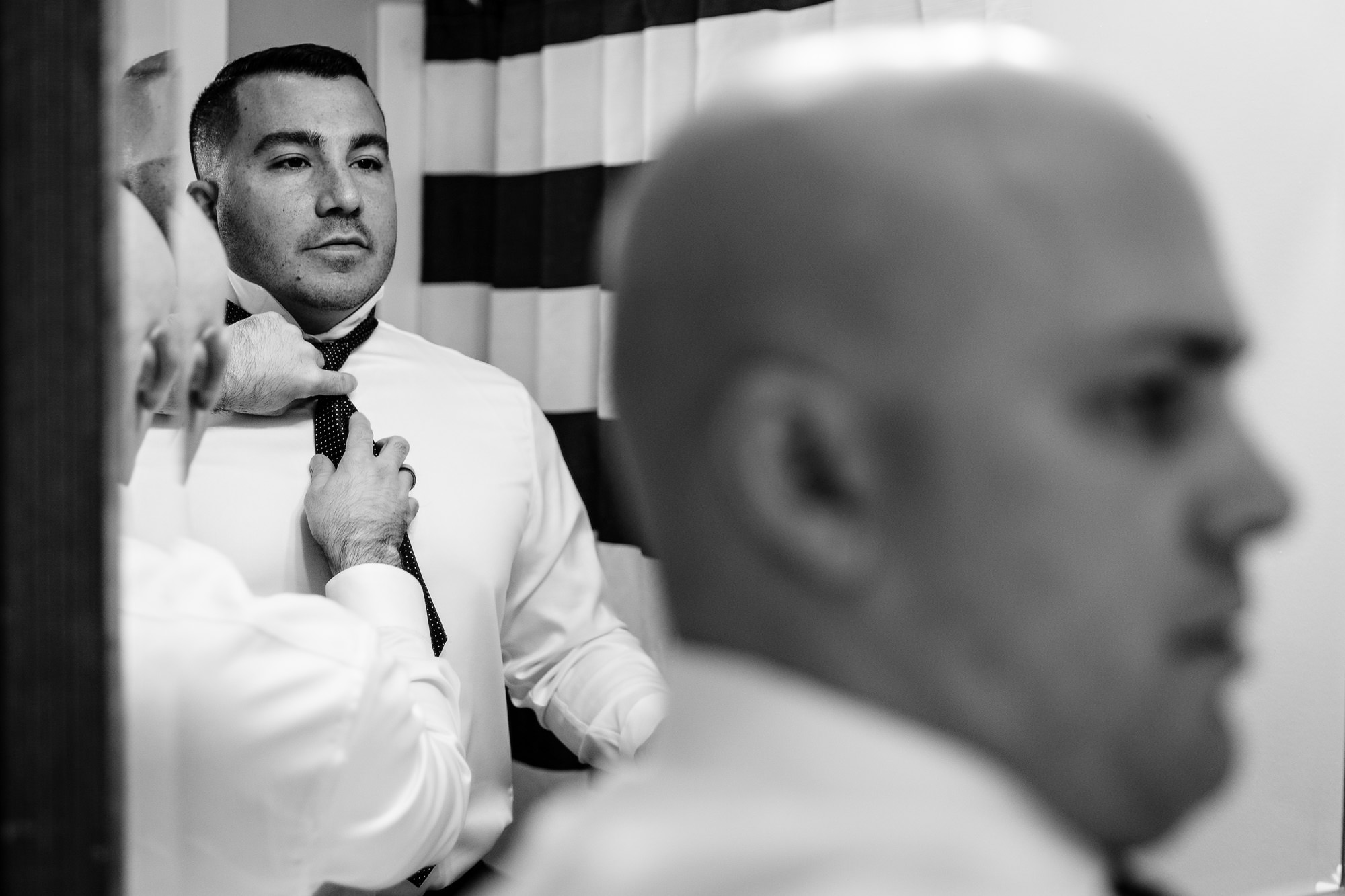 A groom gets ready for his Bar Harbor elopement at Acadia Hotel