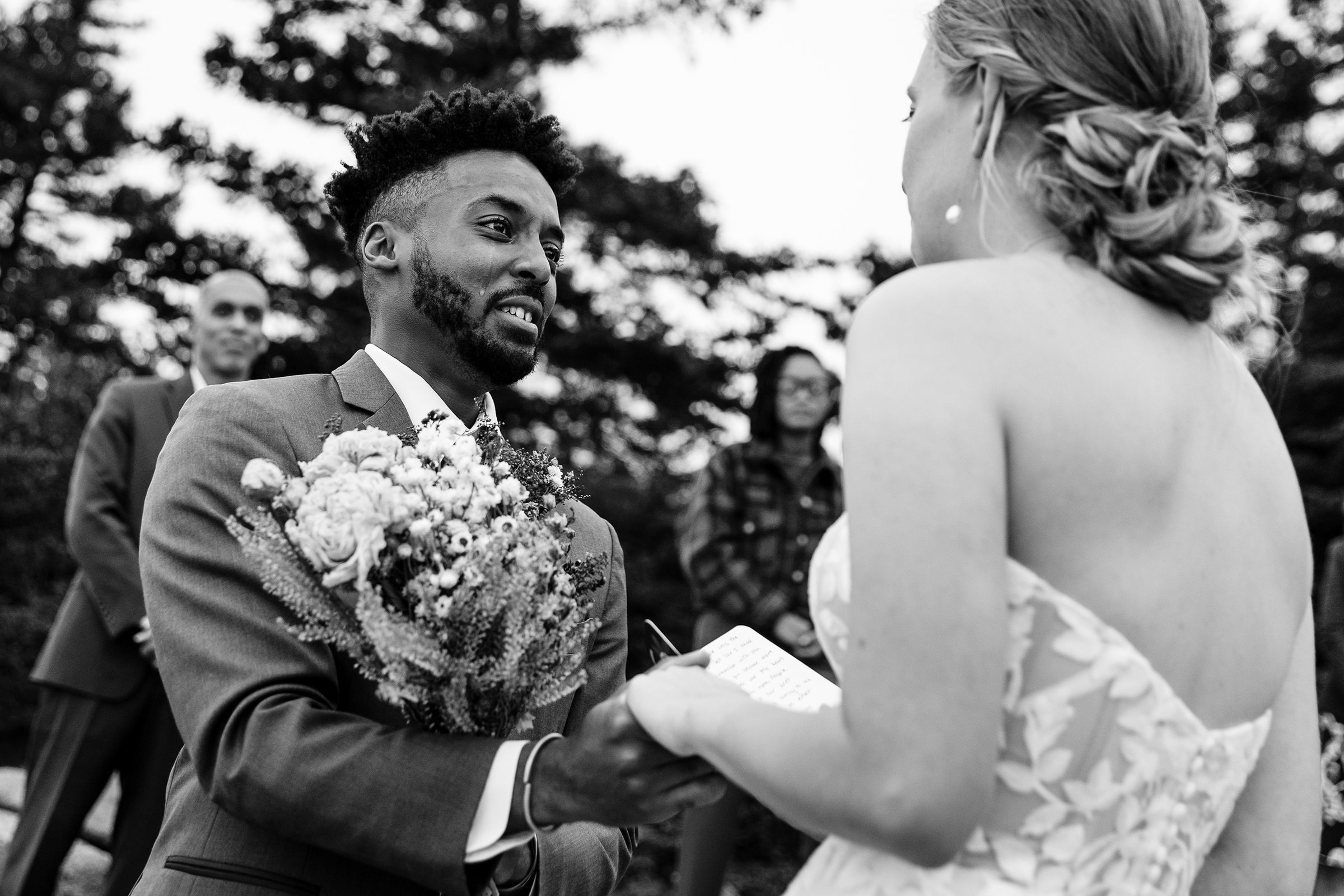 A groom cries during his elopement in Acadia National Park