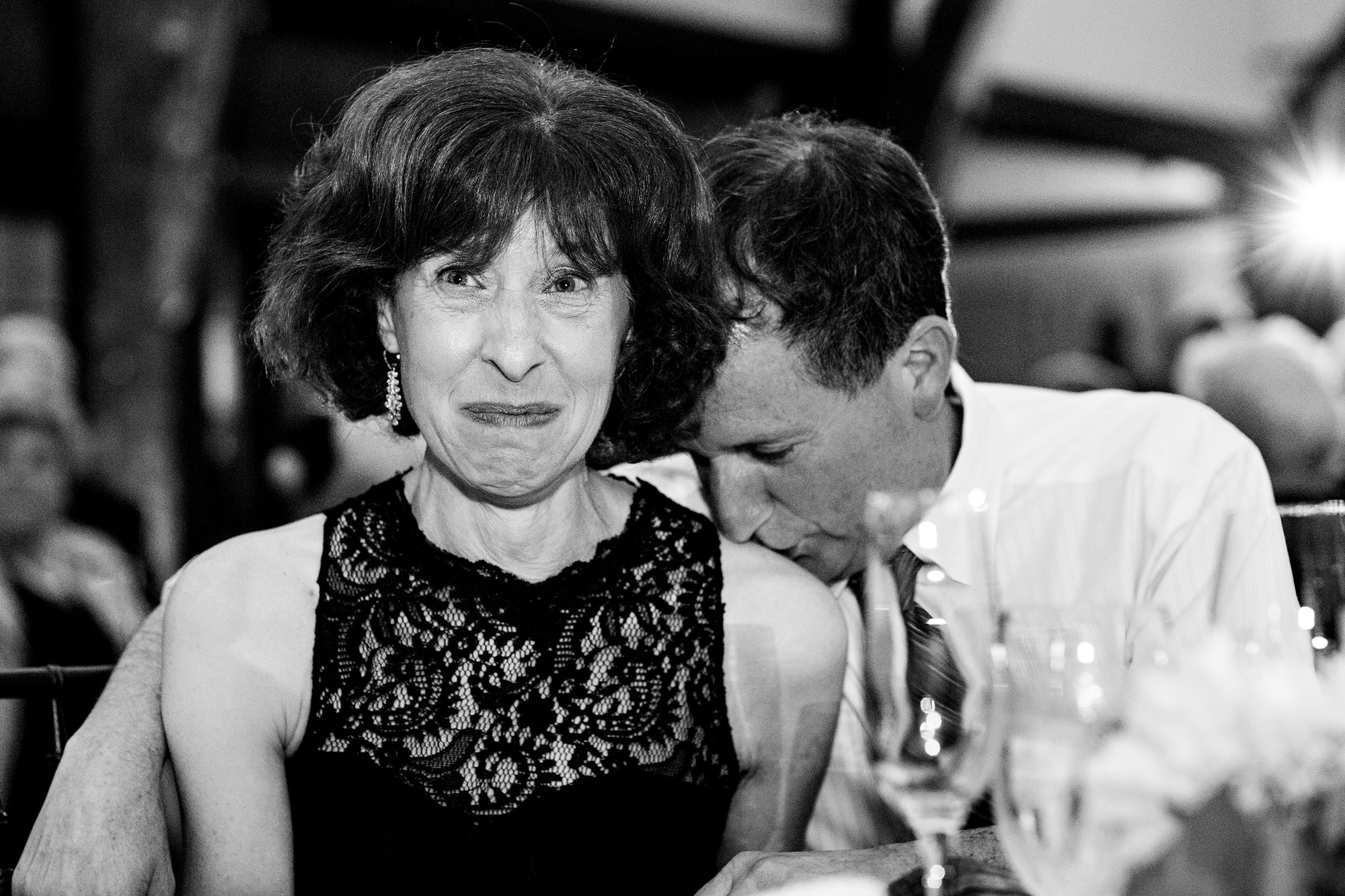 Parents of the couple share an intimate moment during toasts at a Bar Harbor wedding