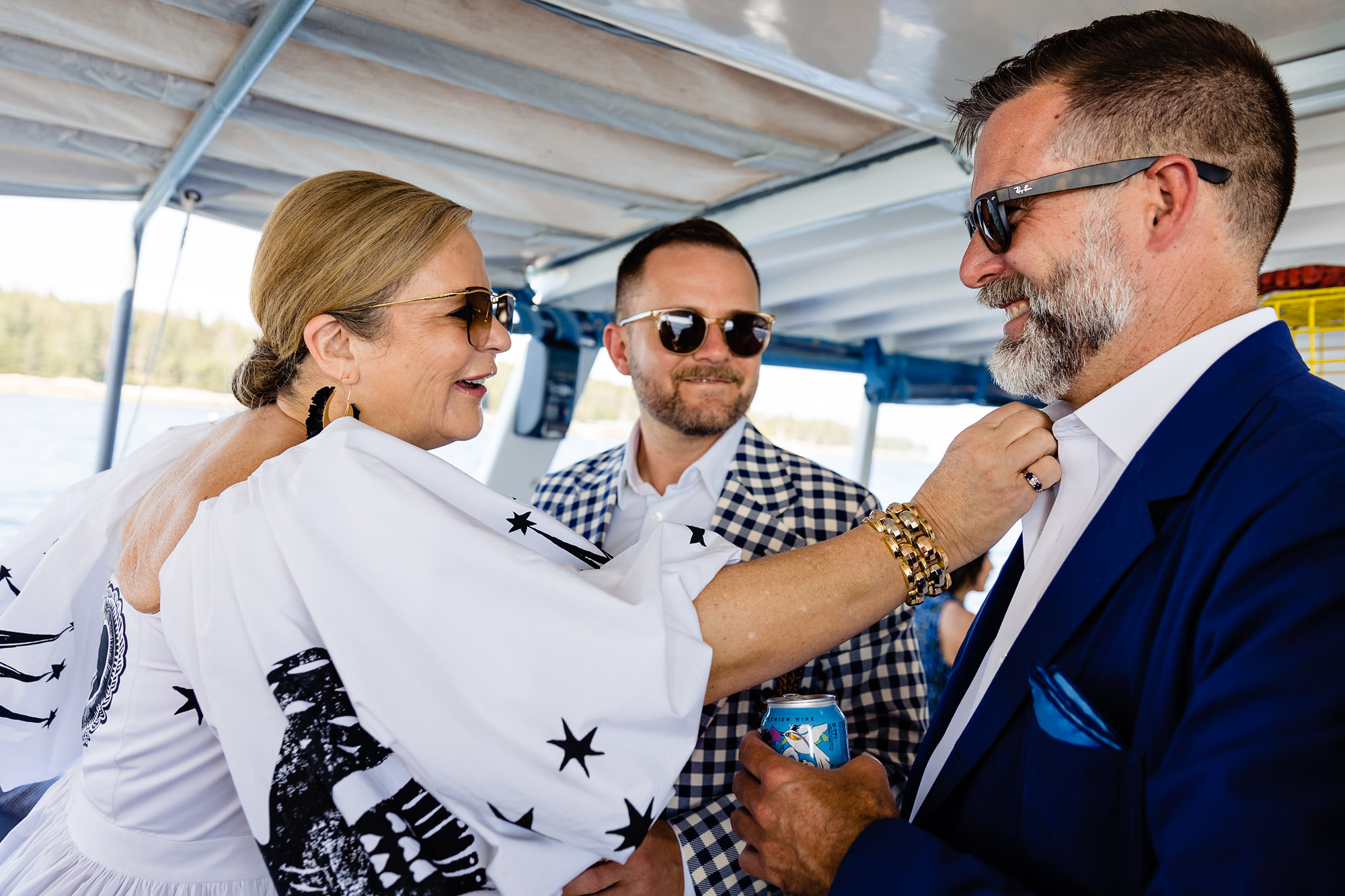 Ames' mom straightens Lance's collar at their Islesford Dock Restaurant Wedding