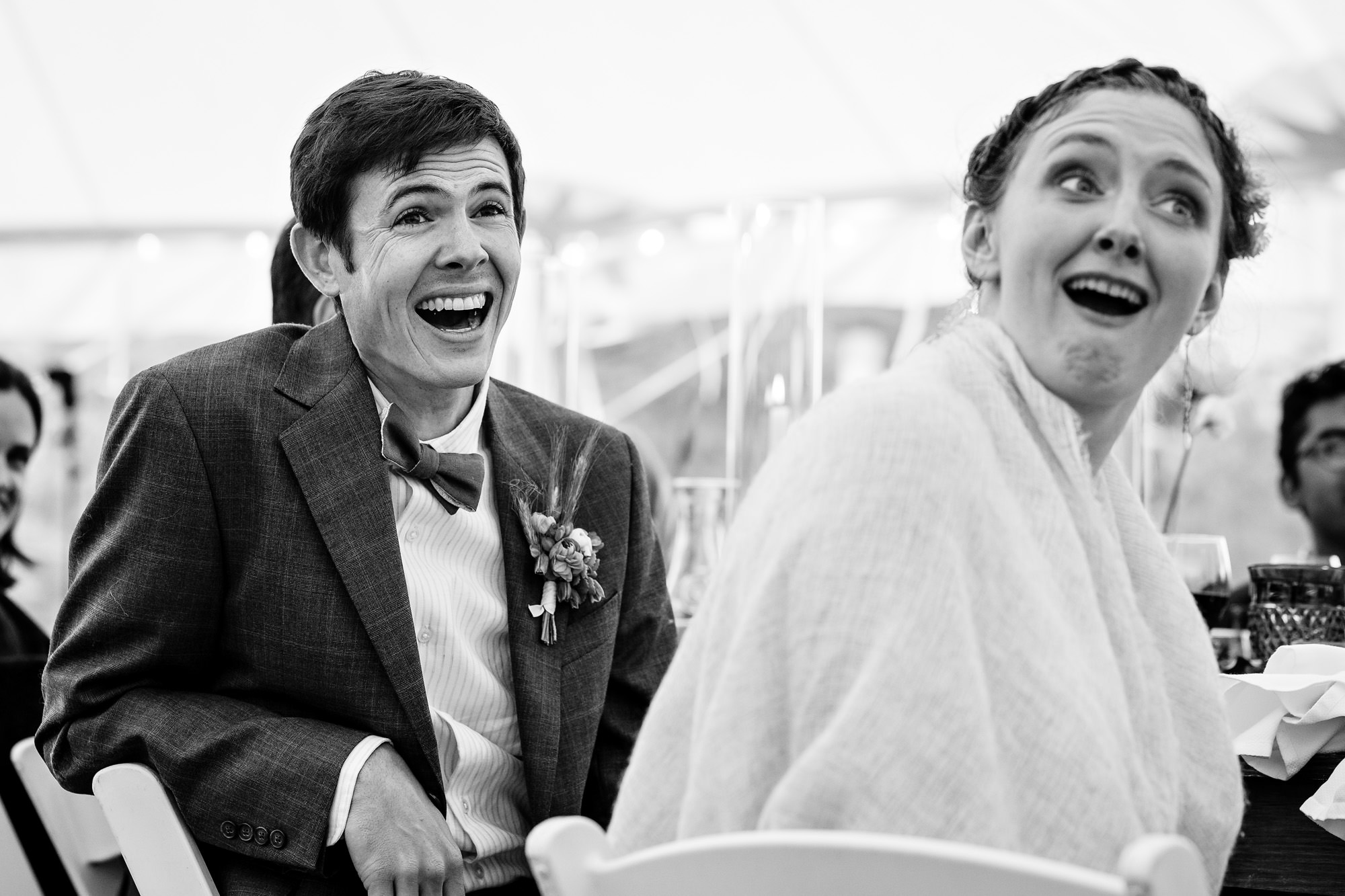 The wedding couple's reaction to toasts during their Chebeague Island Inn wedding