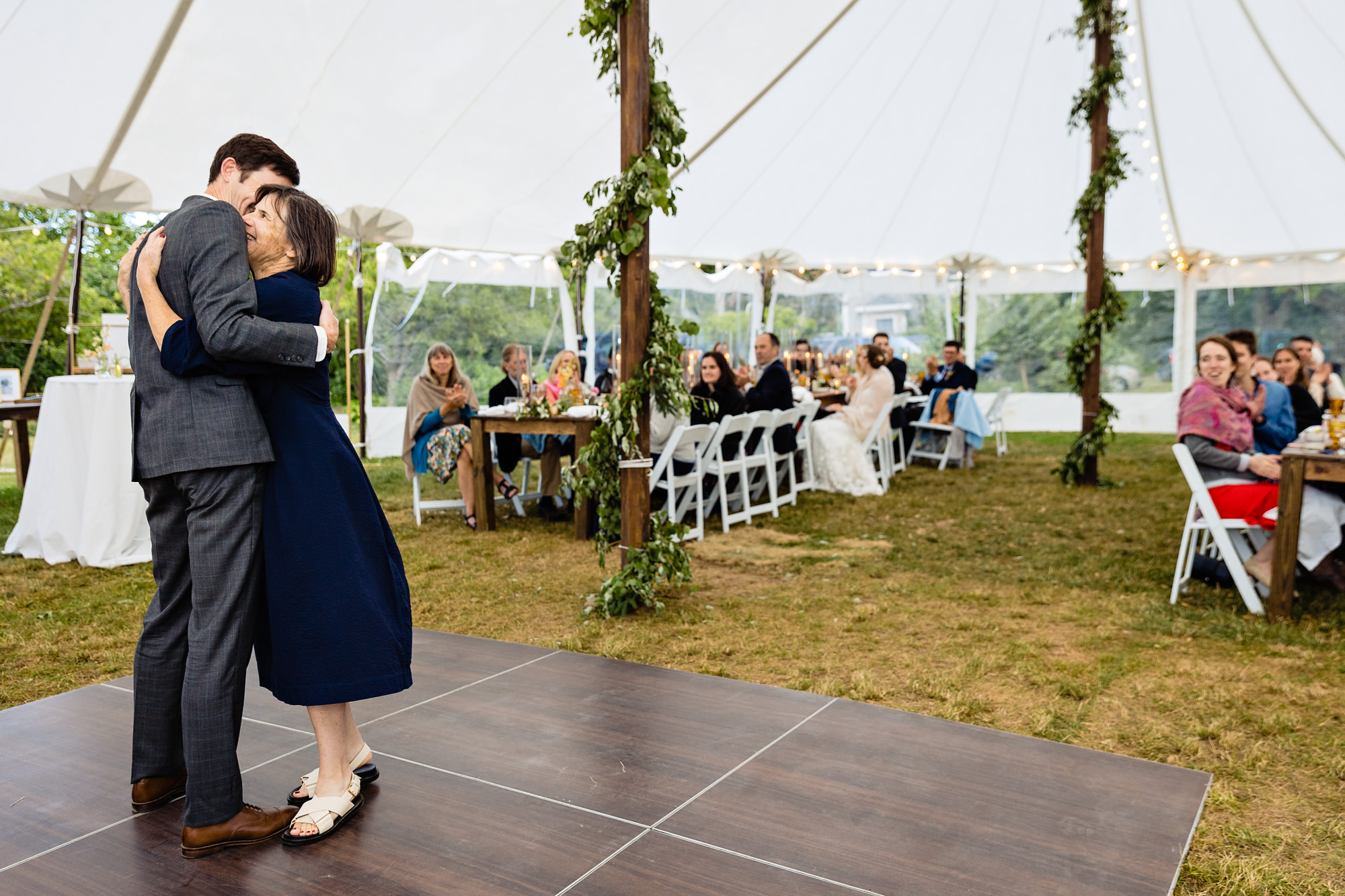 The groom and mother of the groom share a first dance at a Chebeague Island Inn wedding