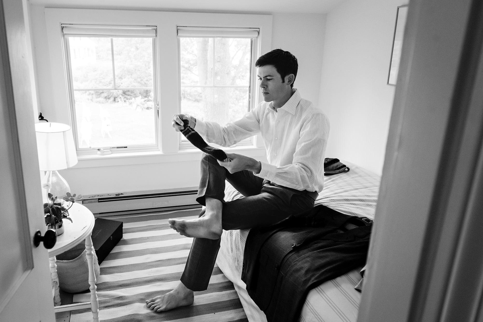 A groom gets dressed at his Chebeague Island Inn wedding