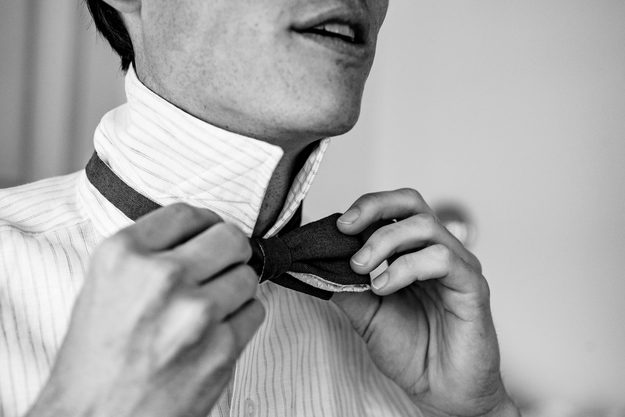 A groom gets dressed at his Chebeague Island Inn wedding