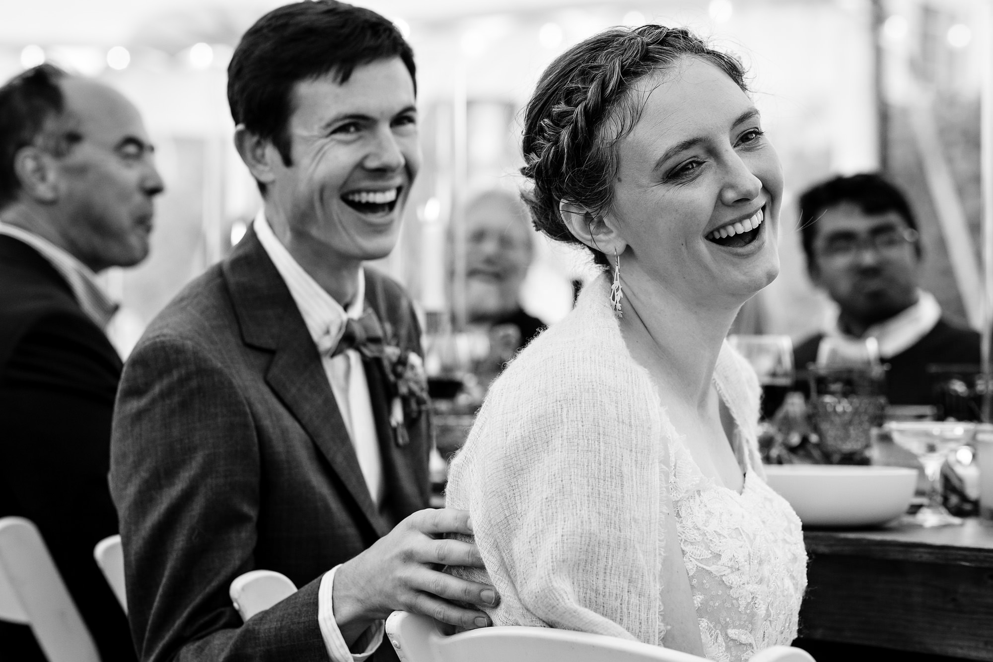 The wedding couple's reaction to toasts during their Chebeague Island Inn wedding