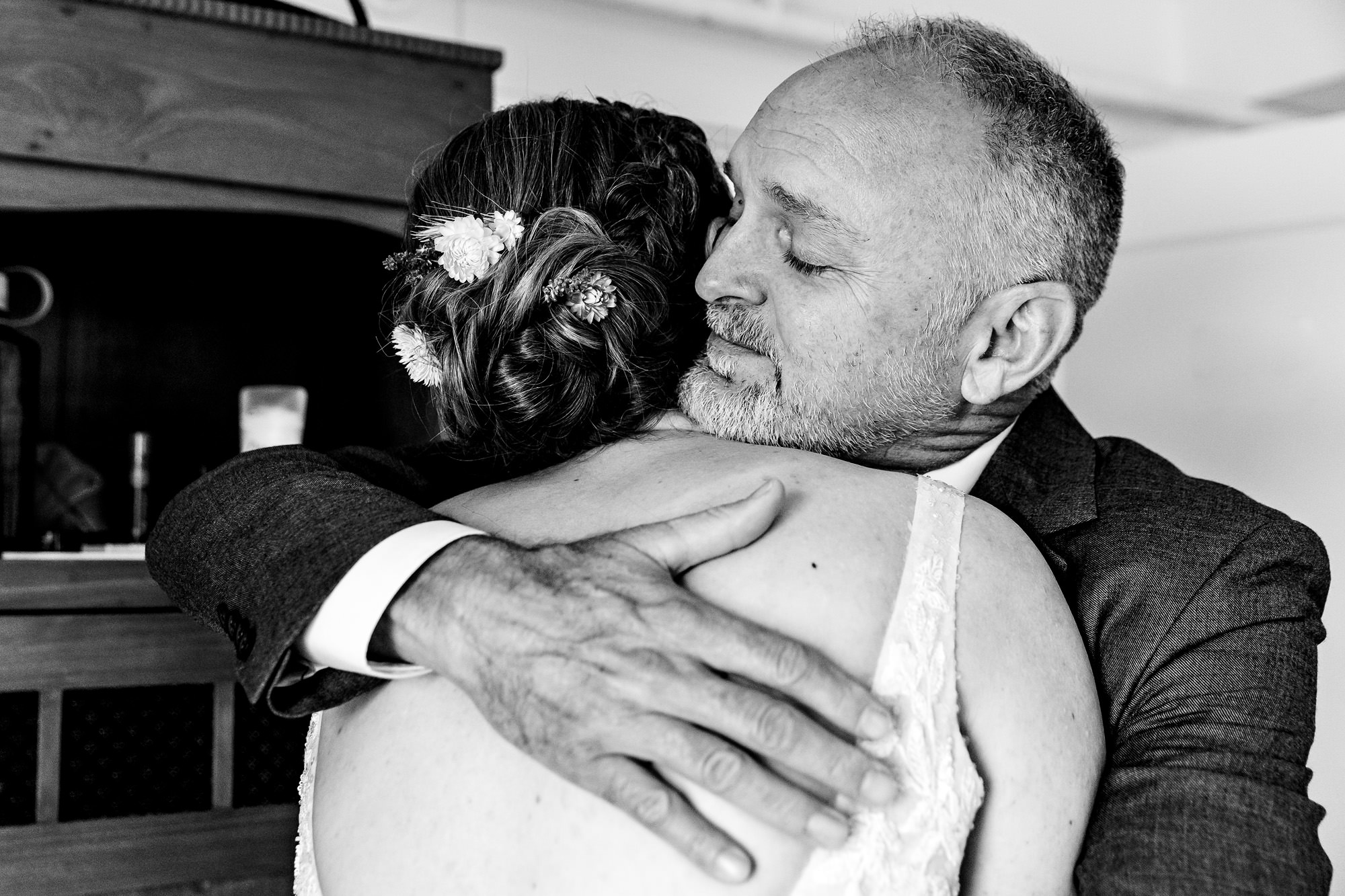 A bride hugs her father at her Chebeague Island Inn wedding
