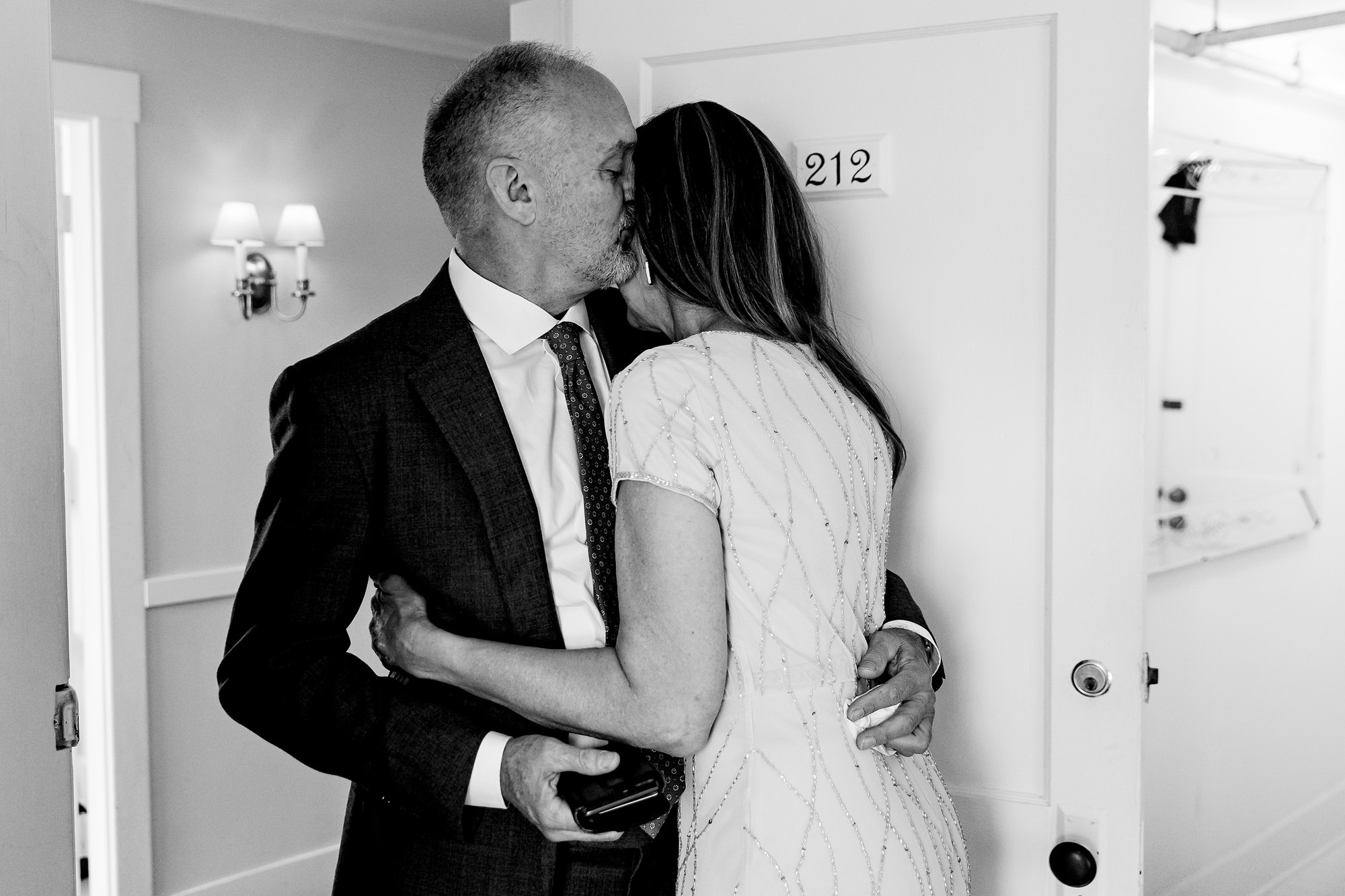 The father of the bride hugs the mother of the bride before the Chebeague Island wedding ceremony