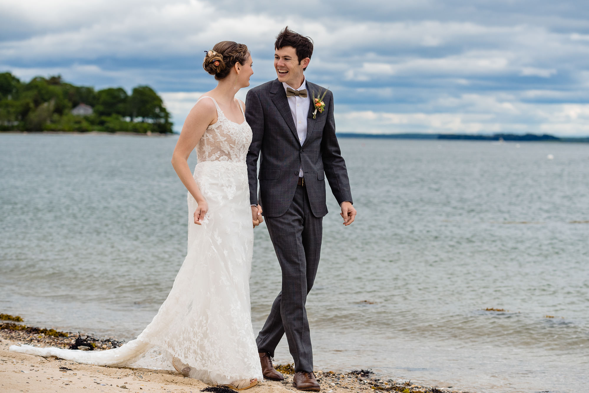 A stunning first look prior to a wedding on a beach on Chebeague Island, Maine