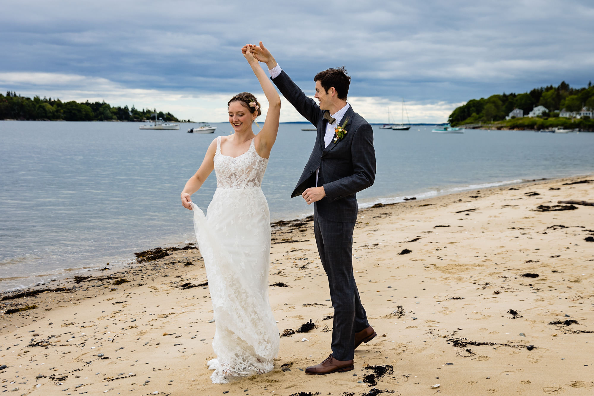 A stunning first look prior to a wedding on a beach on Chebeague Island, Maine