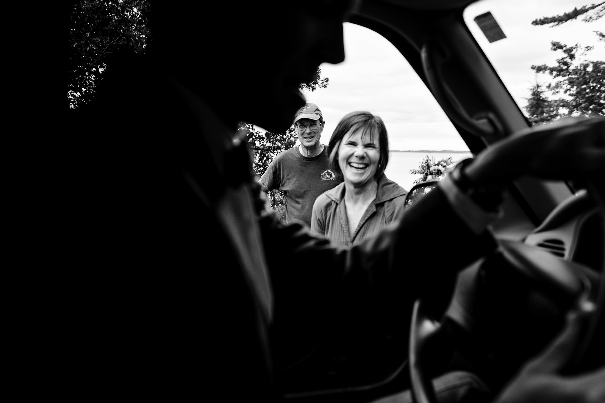 The parents of the groom say goodbye to the groom as he heads off for the first look