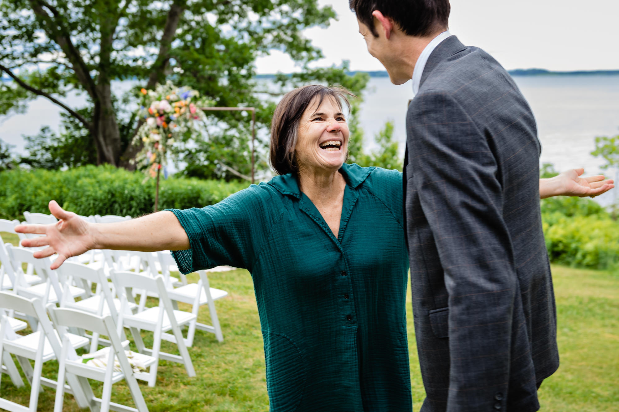 The mother of the groom helps the groom get ready at his Chebeague Island wedding
