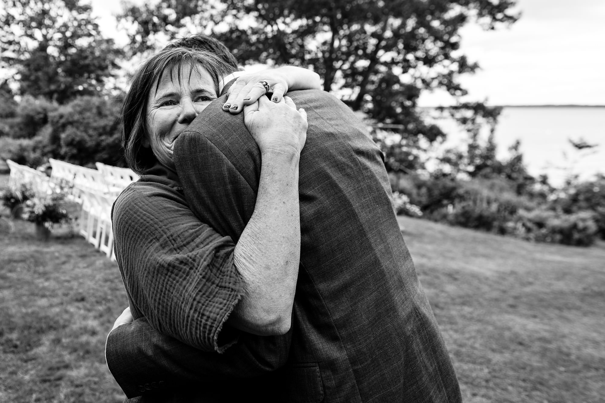 The mother of the groom helps the groom get ready at his Chebeague Island wedding